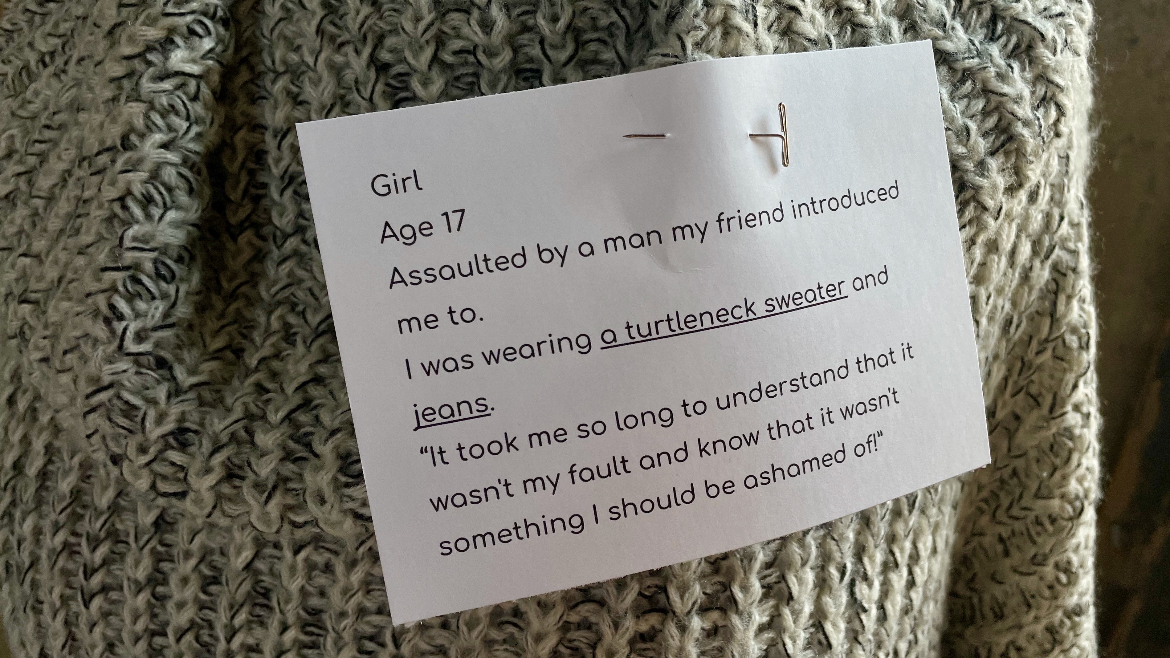 A message pinned to a sweater that's part of the YCC Family Crisis Center's "What were you wearing?" exhibit at the Monarch in Ogden on Thursday.