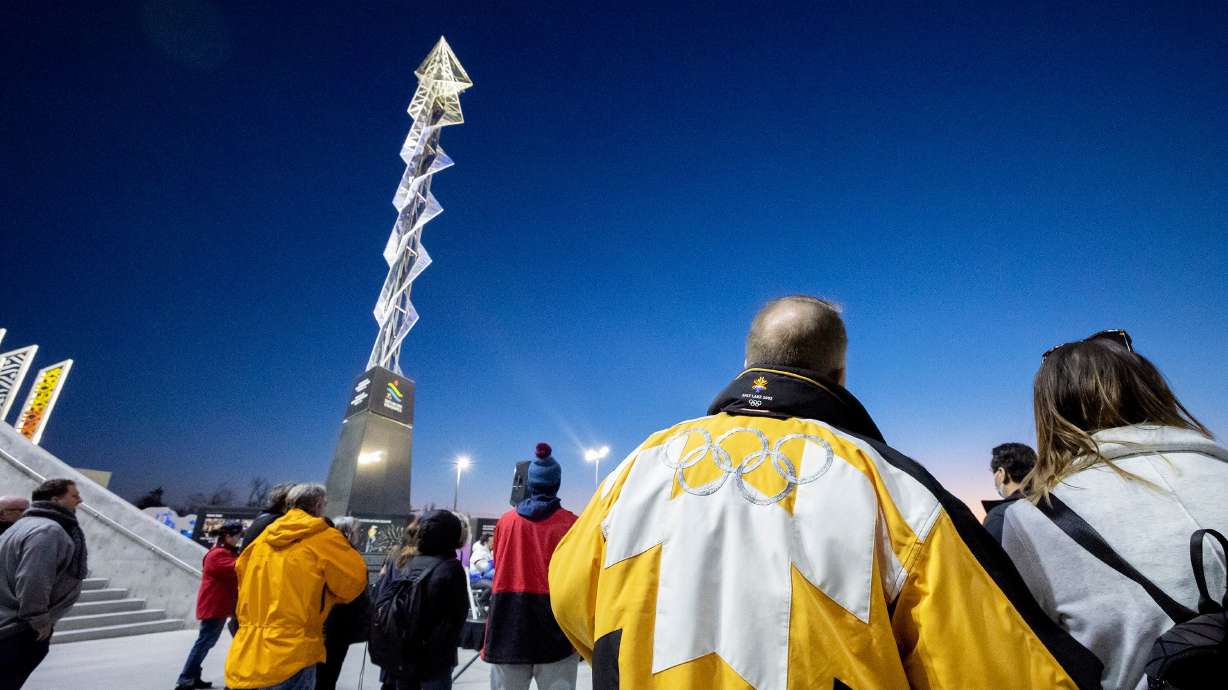 The Olympic Cauldron is lit, marking the 20-year anniversary of the Salt Lake 2002 Olympics opening ceremony at Rice-Eccles Stadium at the University of Utah, Feb. 8, 2022.