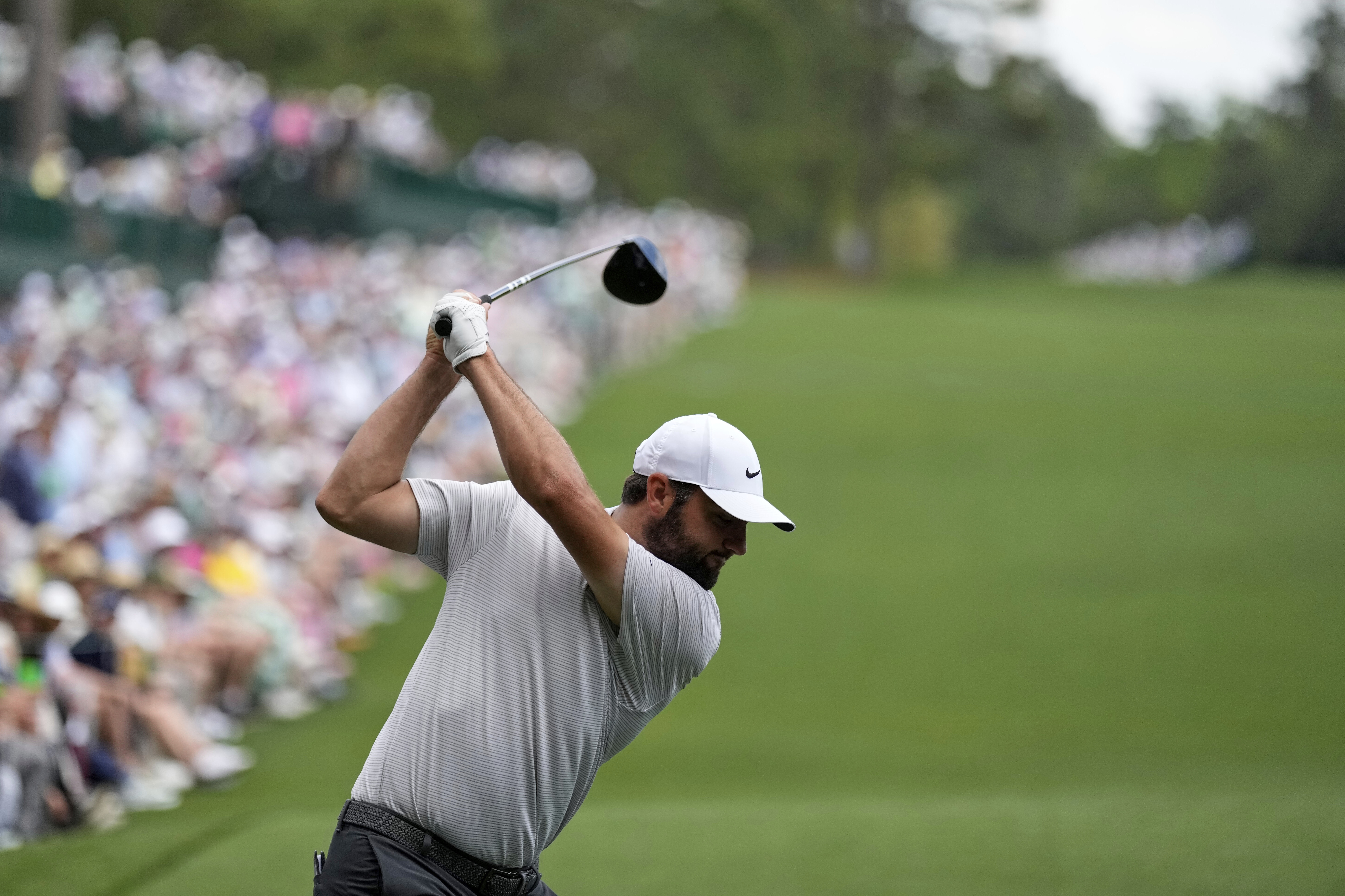 Scottie Scheffler hits his tee shot on the 14th hole during the first round at the Masters golf tournament, Thursday, April 10, 2025, in Augusta, Ga.