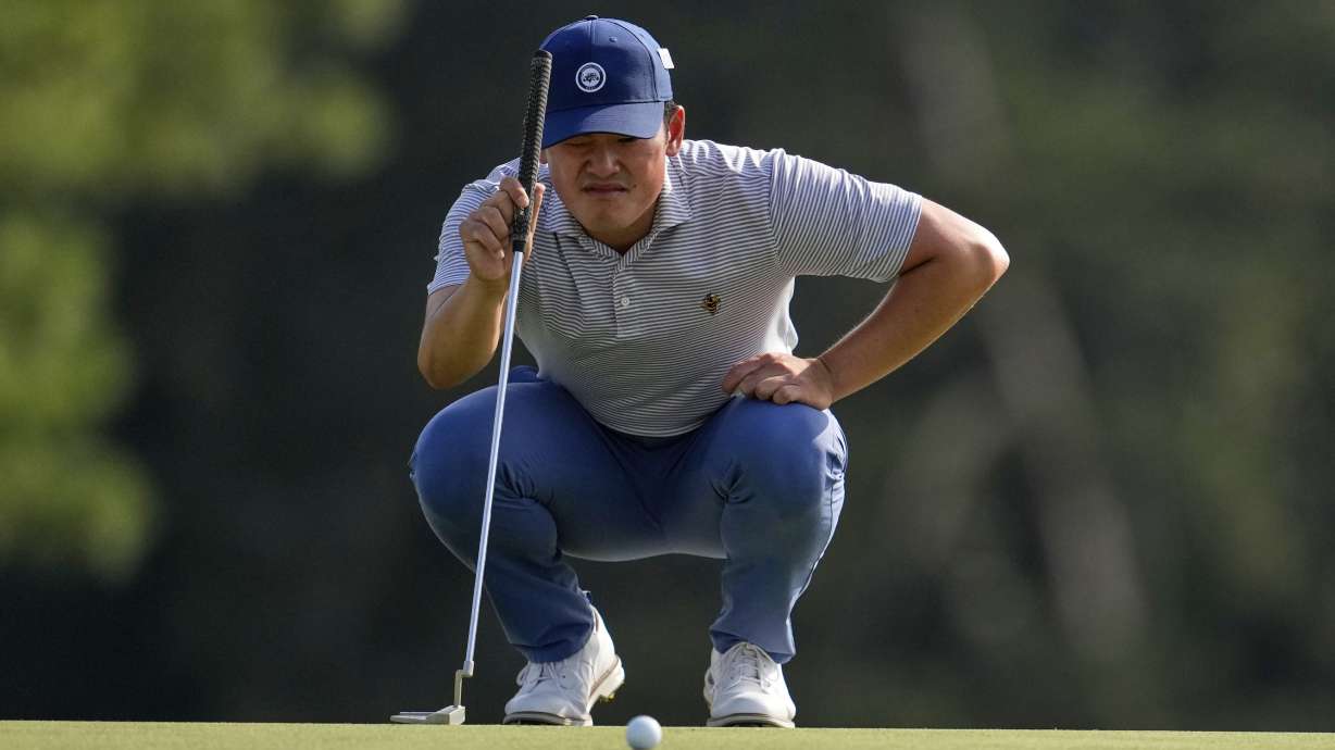 Hiroshi Tai, of Singapore, lines up a putt on the 18th hole during the first round at the Masters golf tournament, Thursday, April 10, 2025, in Augusta, Ga.
