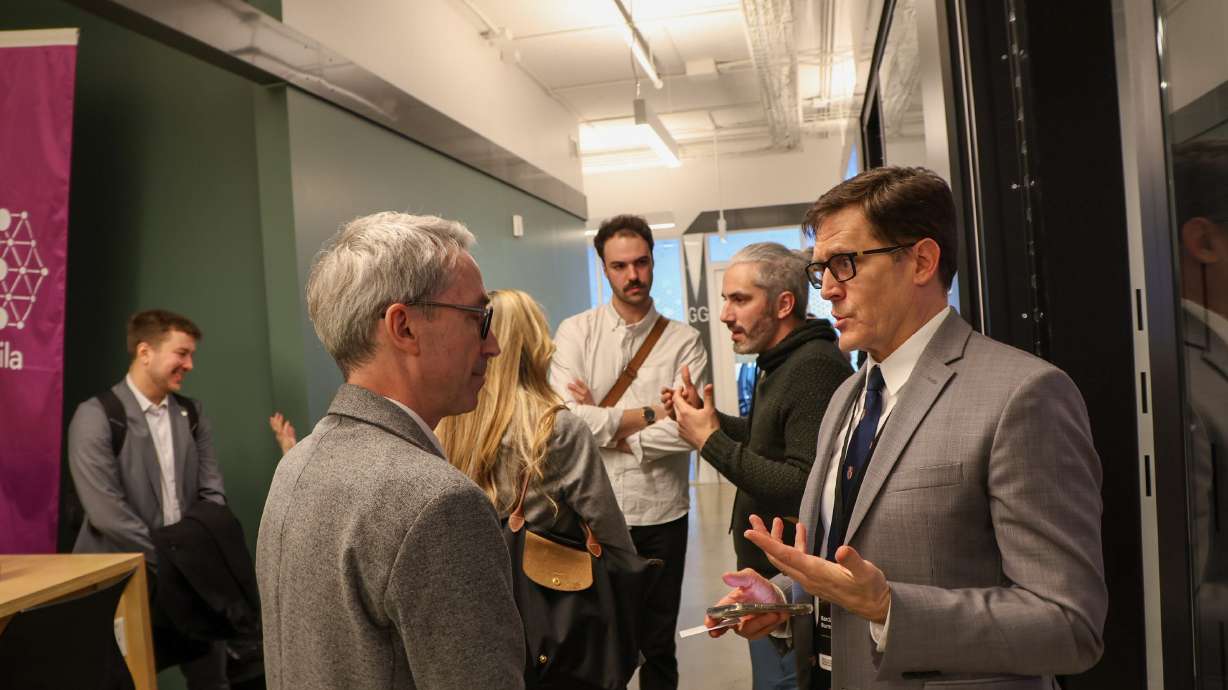Stéphane Létourneau, the executive vice president of the Mila Quebec Artificial Intelligence Institute, speaks with Barclay Burns, chief AI innovation officer at Utah Valley University, in Montreal, Quebec, on Tuesday.