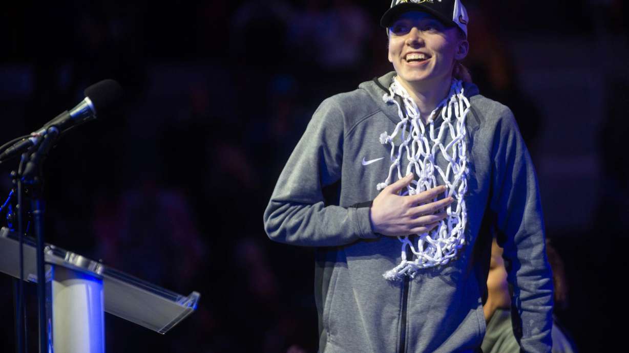 UConn's Paige Bueckers reacts before speaking to fans during an NCAA college basketball "Championship Welcome Home Rally" for the team Monday, April 7, 2025, Storrs, Conn.