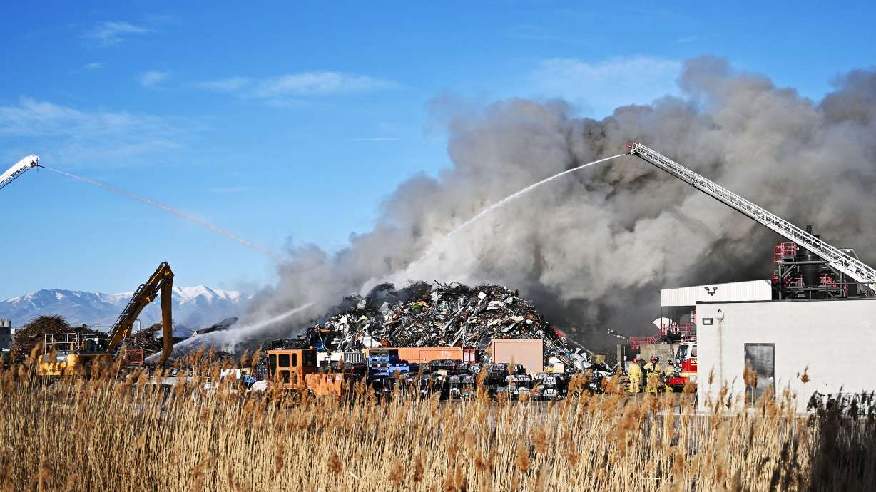 Salt Lake CIty firefighters put water on a fire at Metro Group INC. Recycling and Transloading Services on Friday.