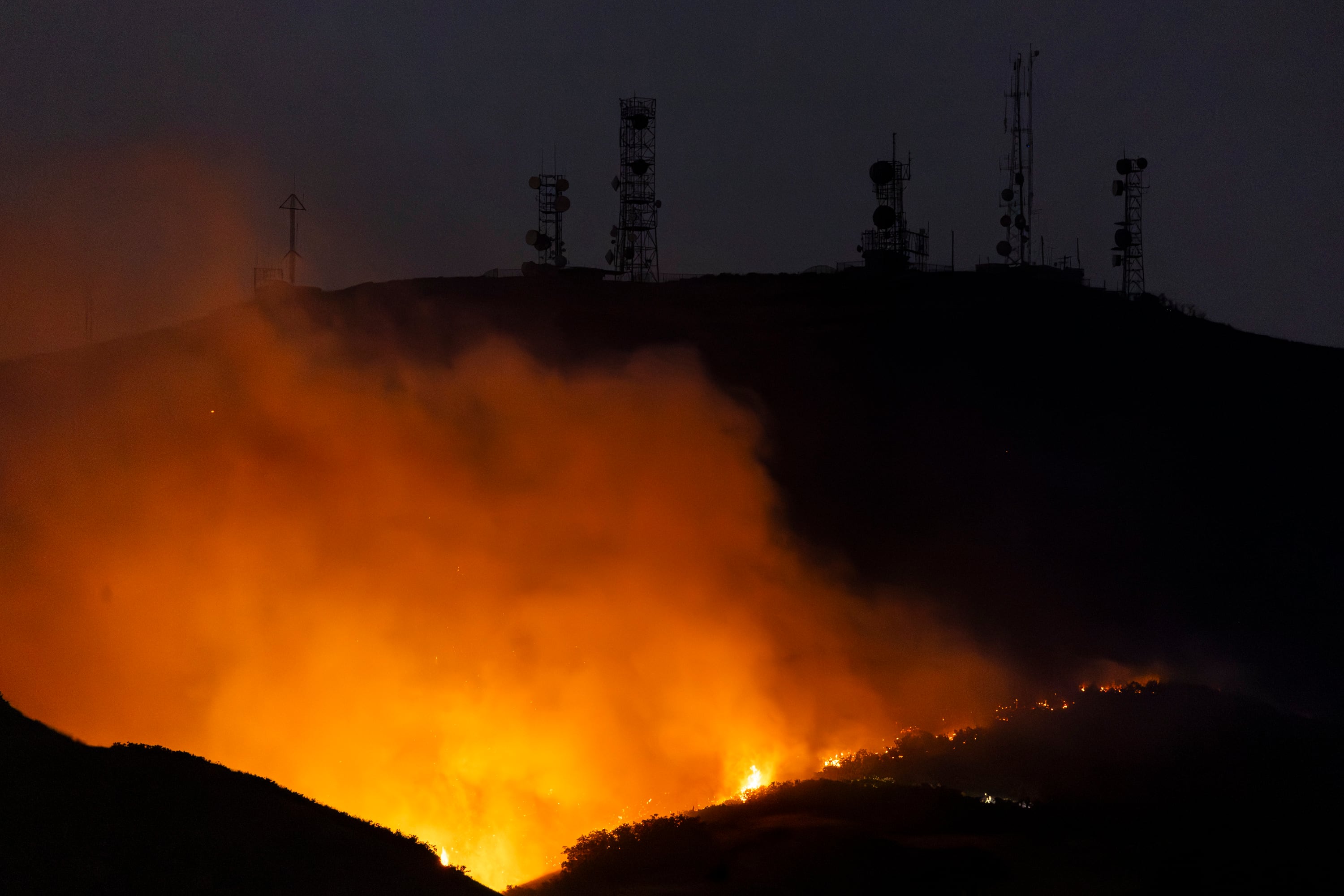 The Sandhurst Fire burns near radio towers above Ensign Peak and north of Salt Lake City on July 20, 2024. Lawmakers, led by Sen. John Curtis, R-Utah, are looking at ways to reduce their number and spread.