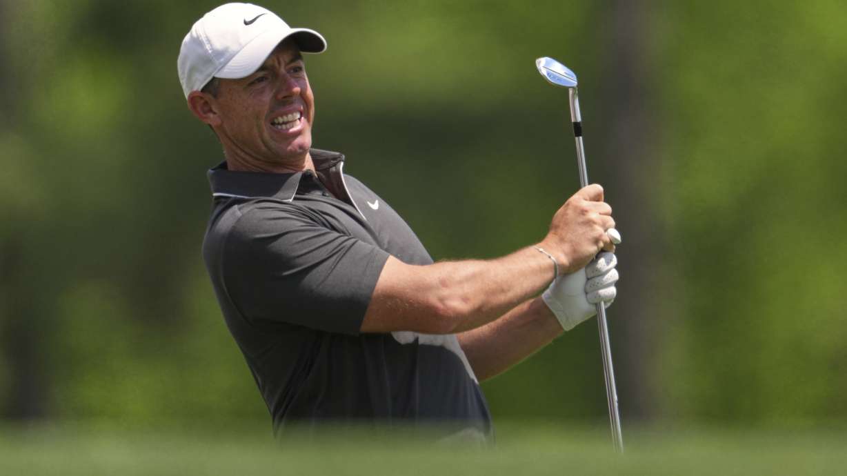 Rory McIlroy, of Northern Ireland, watches his tee shot on the 12th hole during the second round at the Masters golf tournament, Friday, April 11, 2025, in Augusta, Ga.
