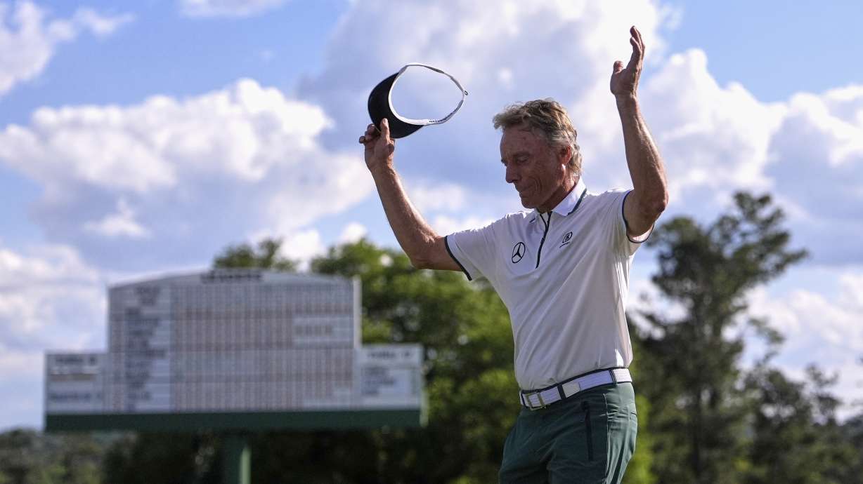 Bernhard Langer, of Germany, waves to the gallery after the second round at the Masters golf tournament, Friday, April 11, 2025, in Augusta, Ga.