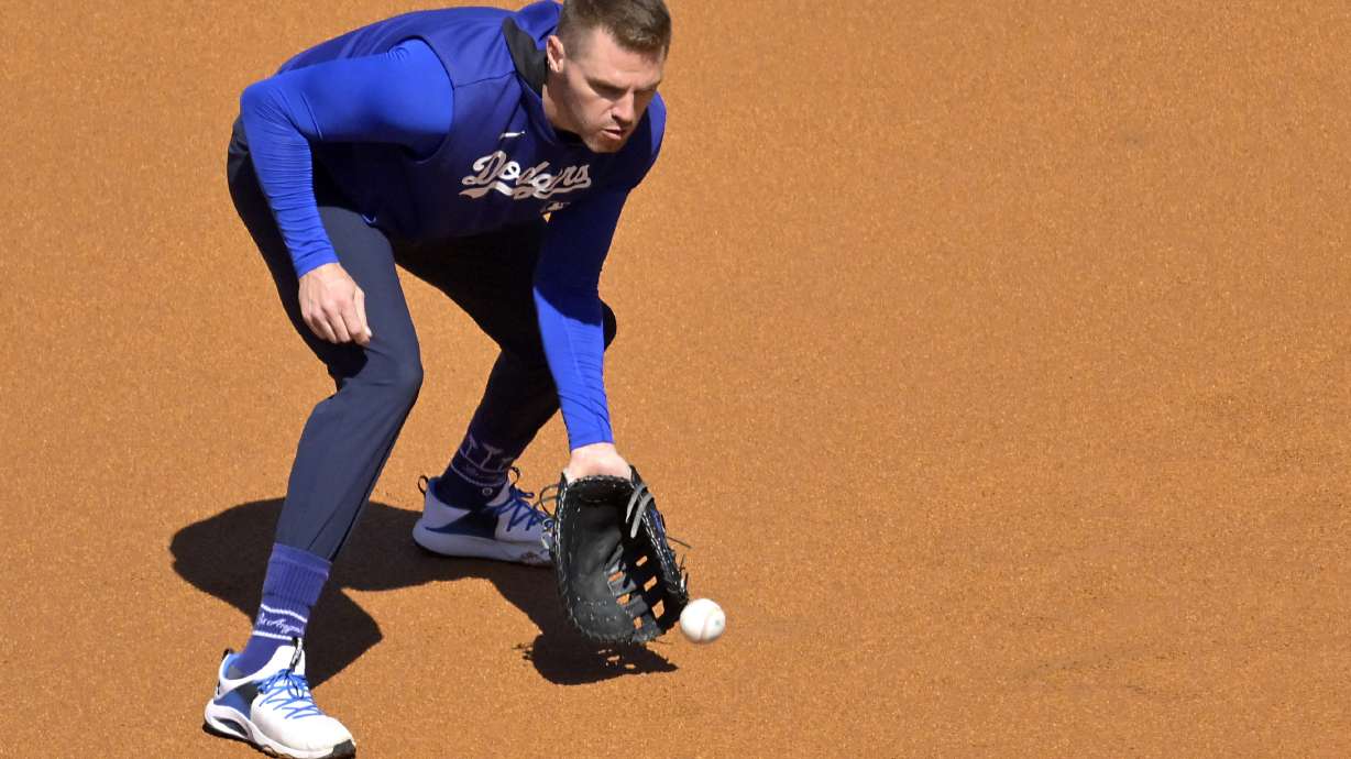 Los Angeles Dodgers first baseman Freddie Freeman warms up prior to a baseball game against the Chicago Cubs, Friday, April 11, 2025, in Los Angeles.