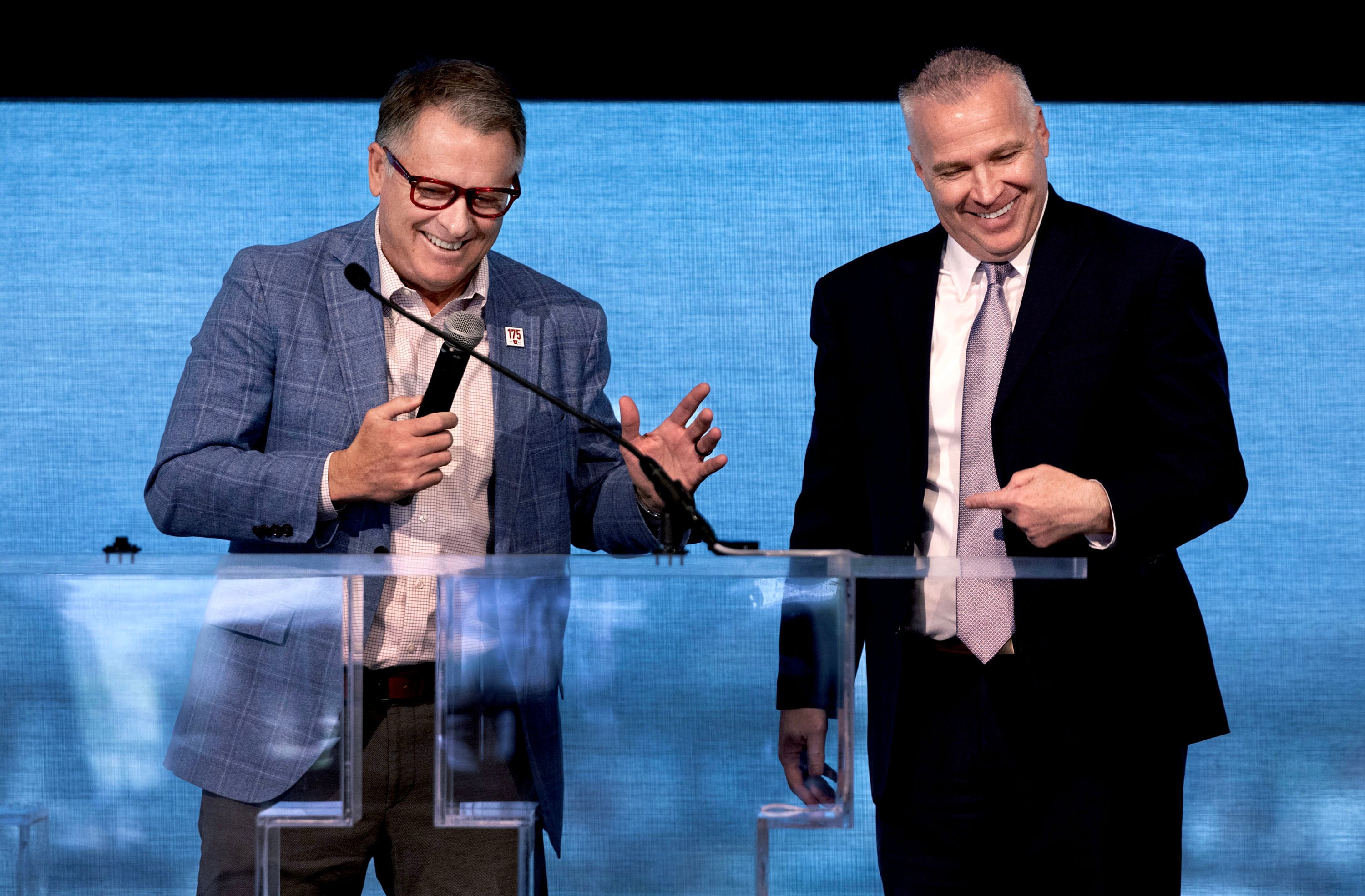 Taylor Randall, president of the University of Utah, and Shane Reese, president of Brigham Young University, joke around at the second annual Kindness Summit at the University of Utah in Salt Lake City on Friday.