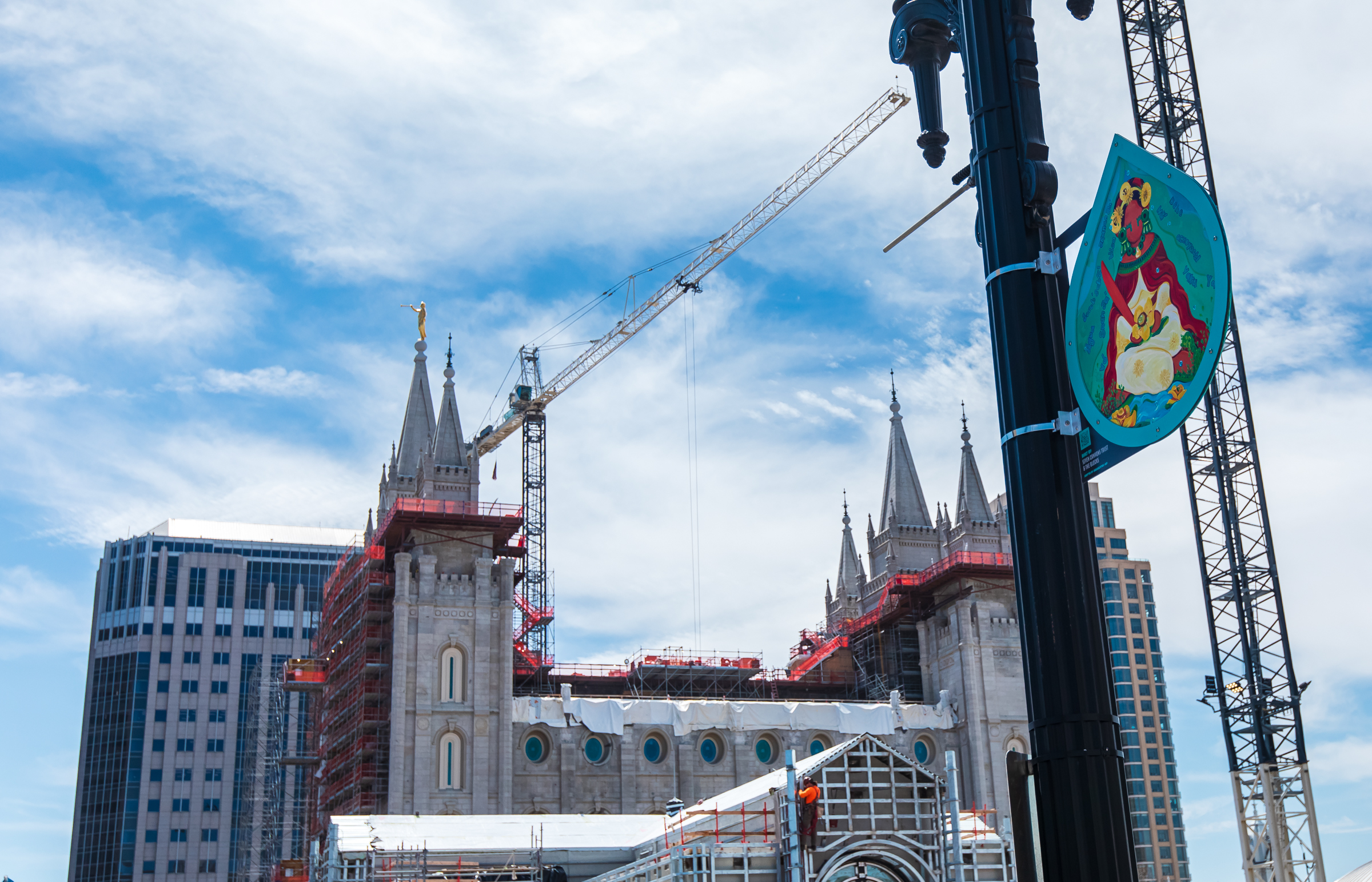 Vicky Lowe's painting of a water protector is visible from North Temple near the Salt Lake Temple in Salt Lake City on Friday.