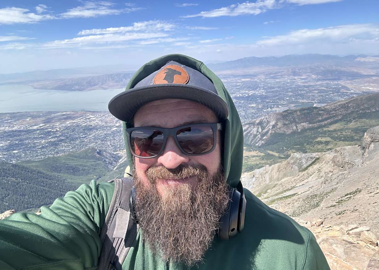 Provo hiker Tennison Hunter summits Mount Timpanogos in 2024. Hunter has found peace through reconnecting with nature.
