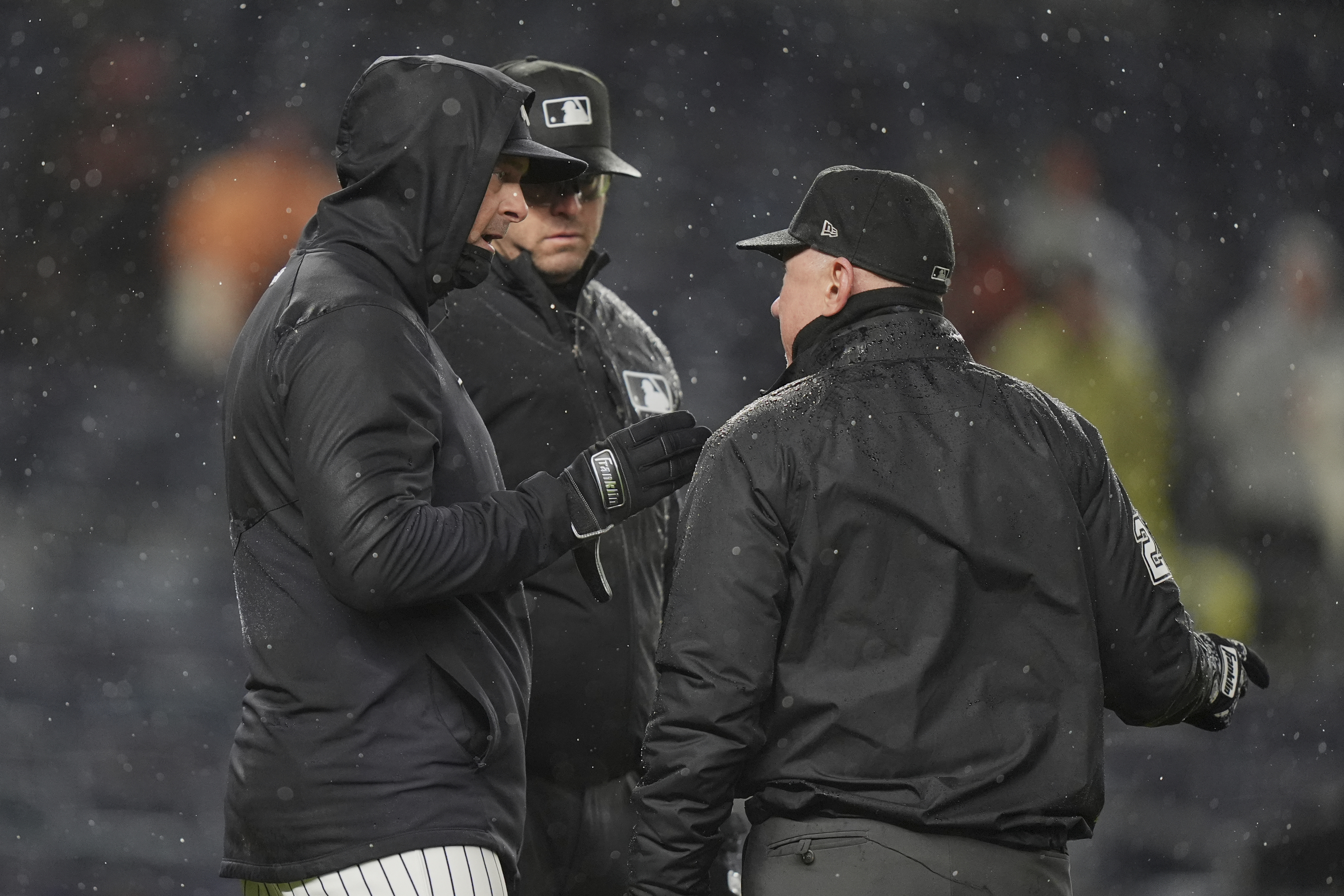 New York Yankees manager Aaron Boone talks to umpire Lance Barksdale during the sixth inning of a baseball game against the San Francisco Giants Friday, April 11, 2025, in New York.