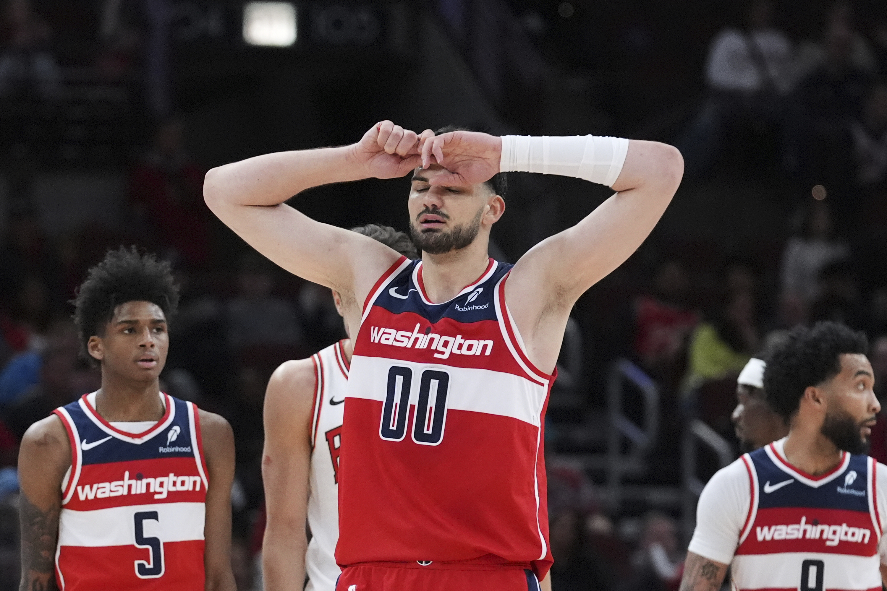 Washington Wizards forward Tristan Vukcevic (00) reacts after a missed a shot during the second half of an NBA basketball game against the Chicago Bulls in Chicago, Friday, April 11, 2025.