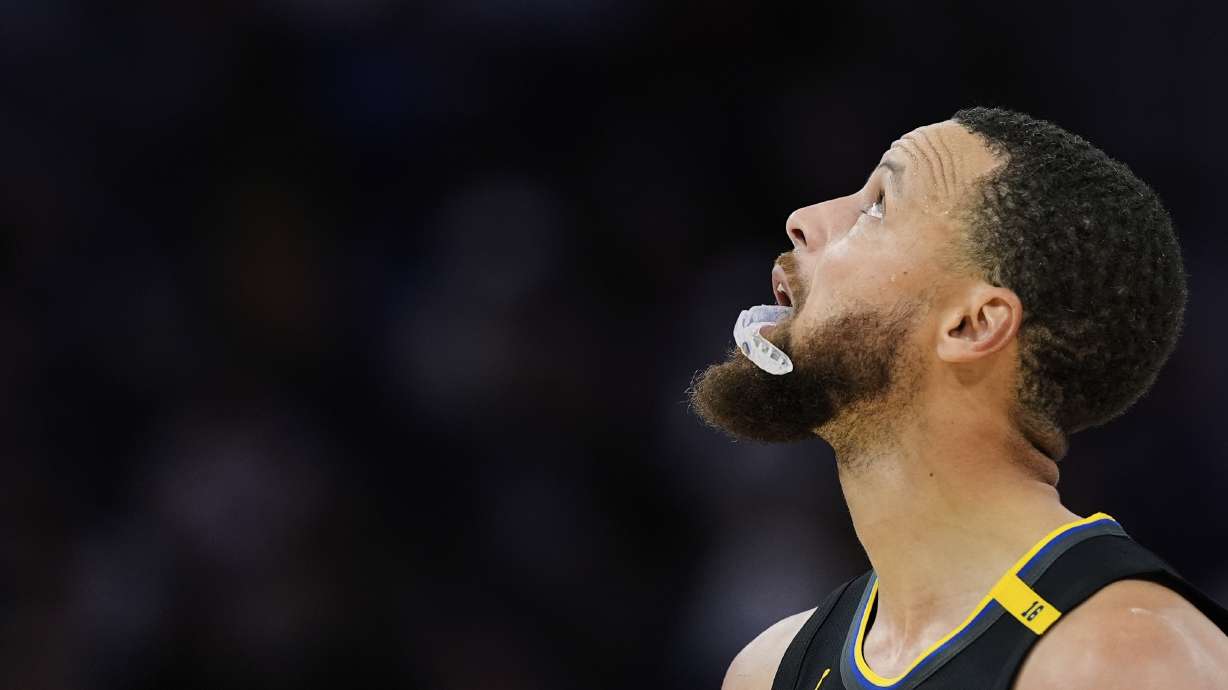 Golden State Warriors guard Stephen Curry looks at the scoreboard during the second half of an NBA basketball game against the San Antonio Spurs, Wednesday, April 9, 2025, in San Francisco.