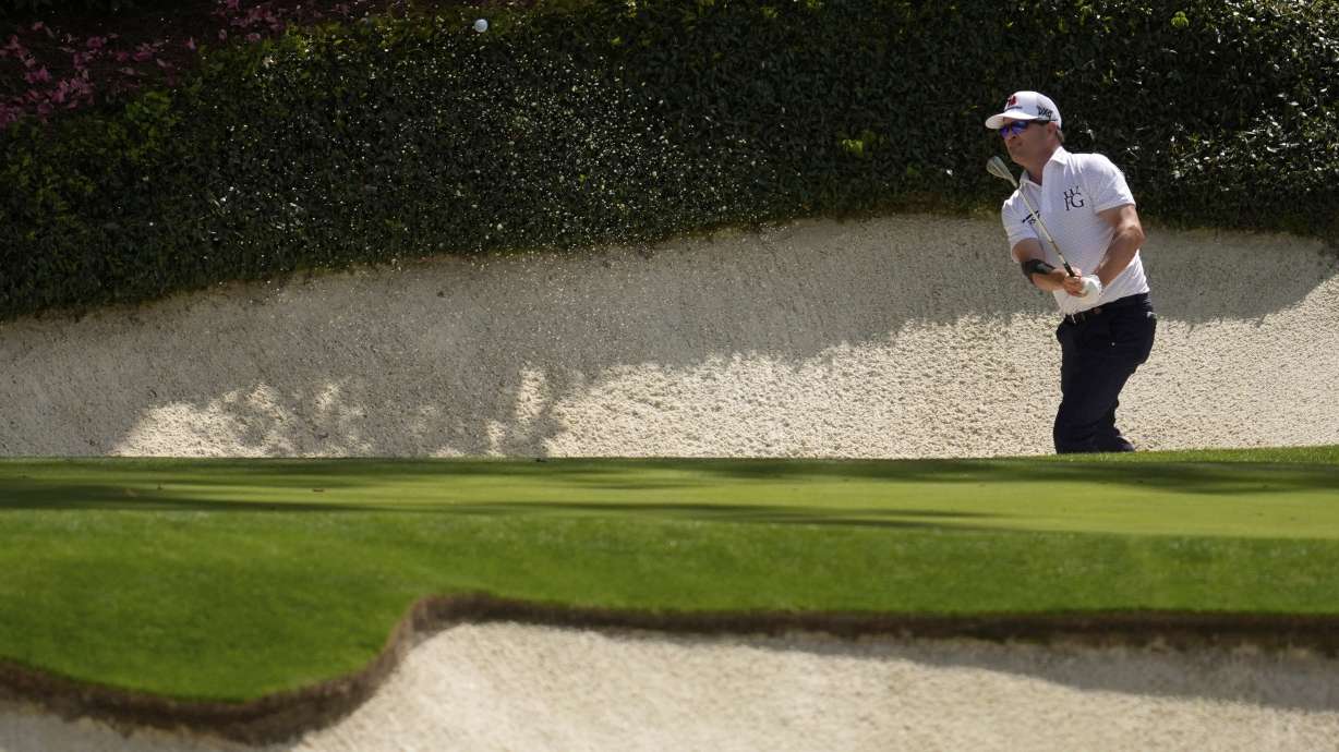 Zach Johnson hits from the bunker on the 12th hole during the second round at the Masters golf tournament, Friday, April 11, 2025, in Augusta, Ga.