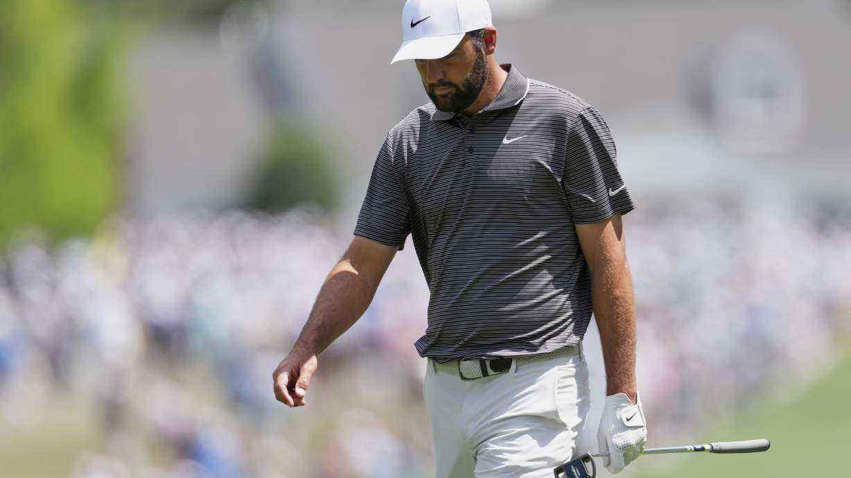 Scottie Scheffler walks to the green on the first hole during the third round at the Masters golf tournament, Saturday, April 12, 2025, in Augusta, Ga.