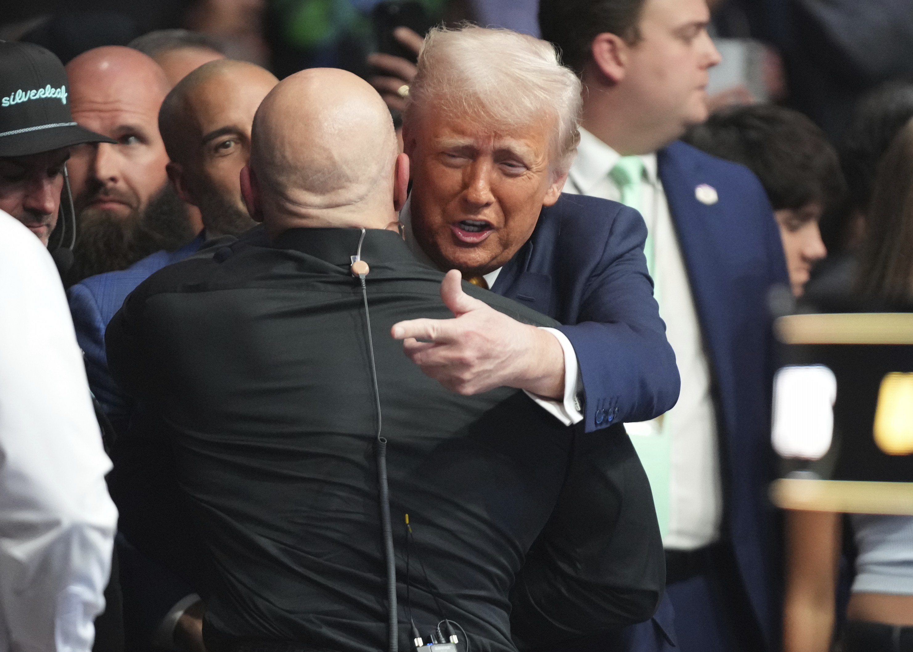 President Donald Trump, right, attends a mixed martial arts fight at UFC 314, Saturday, April 12, 2025, in Miami. 