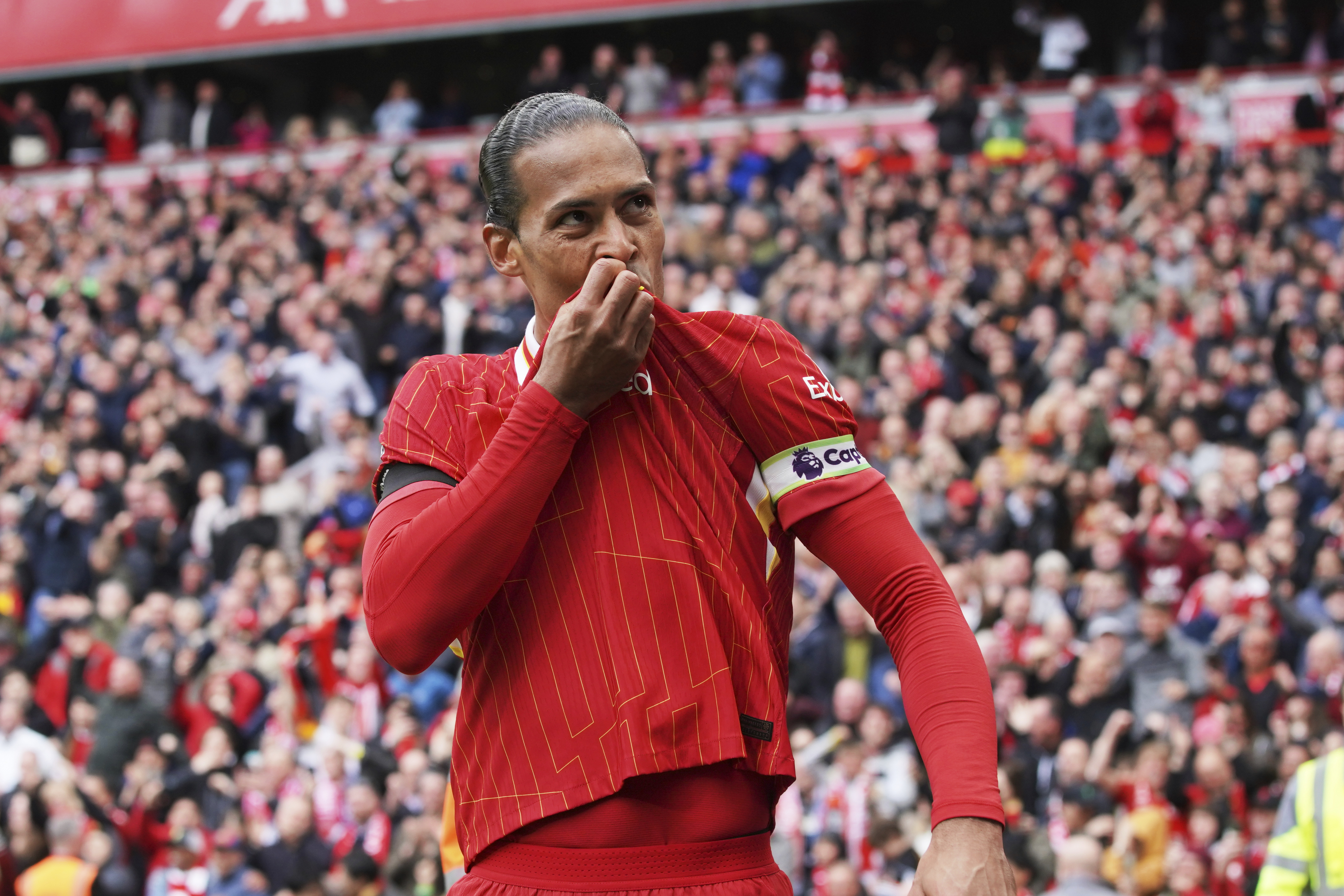 Liverpool's Virgil van Dijk celebrates after scoring his side's second goal during the English Premier League soccer match between Liverpool and West Ham United at Anfield in Liverpool, Sunday, April 13, 2025.