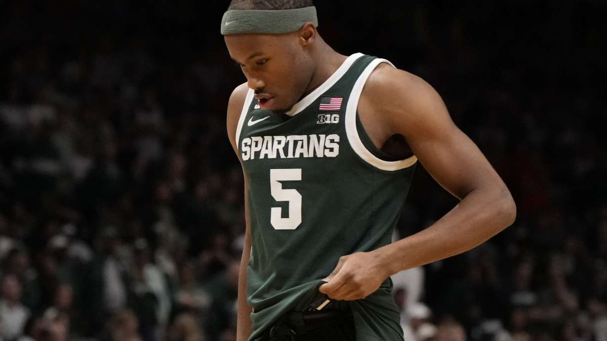 Michigan State guard Tre Holloman walks off the court after the second half in the Elite Eight of the NCAA college basketball tournament against Auburn, Sunday, March 30, 2025, in Atlanta.