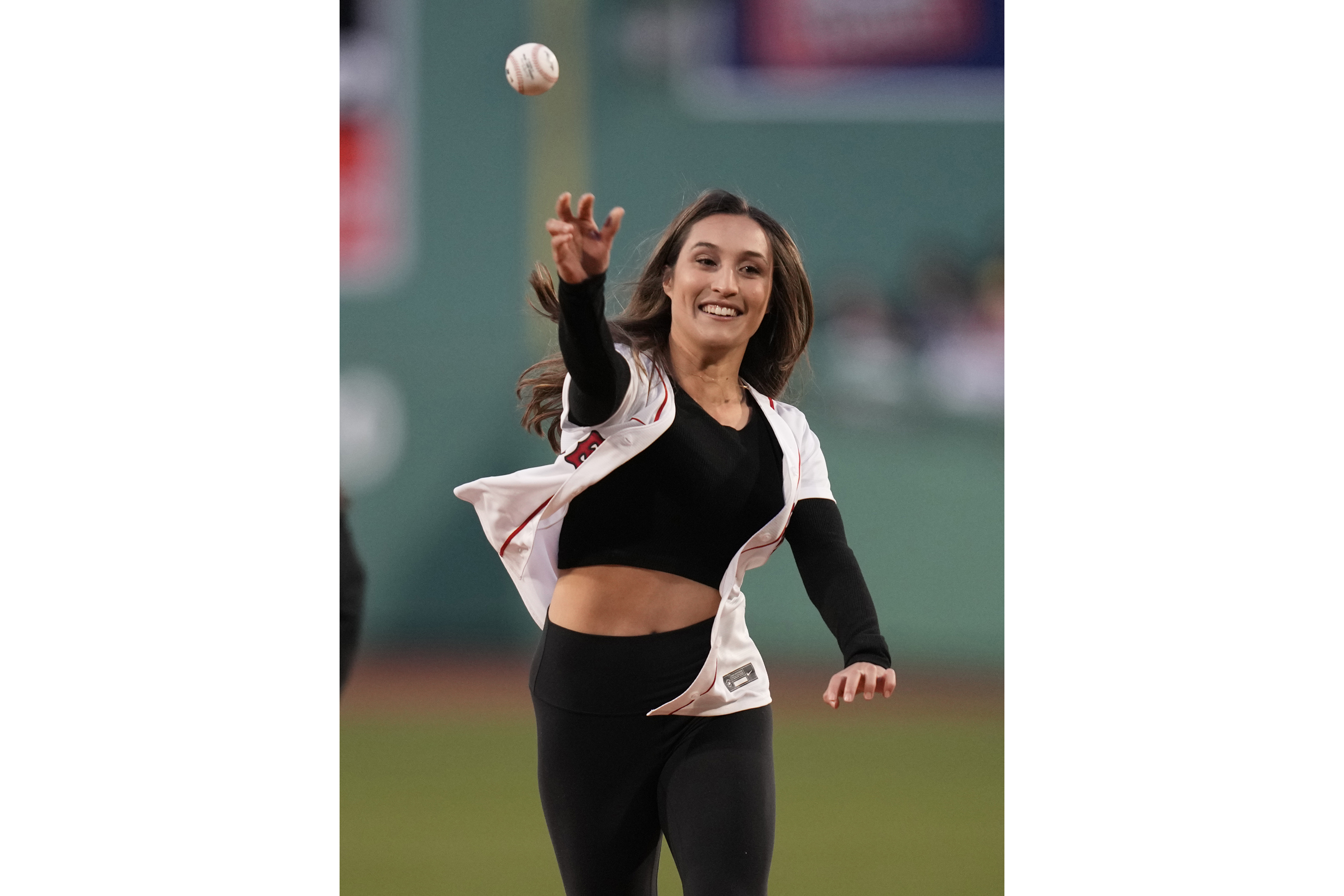 FILE - MIT women's soccer graduate student Karenna Groff throws a ball prior to a baseball game at Fenway Park, Monday, April 3, 2023, in Boston.