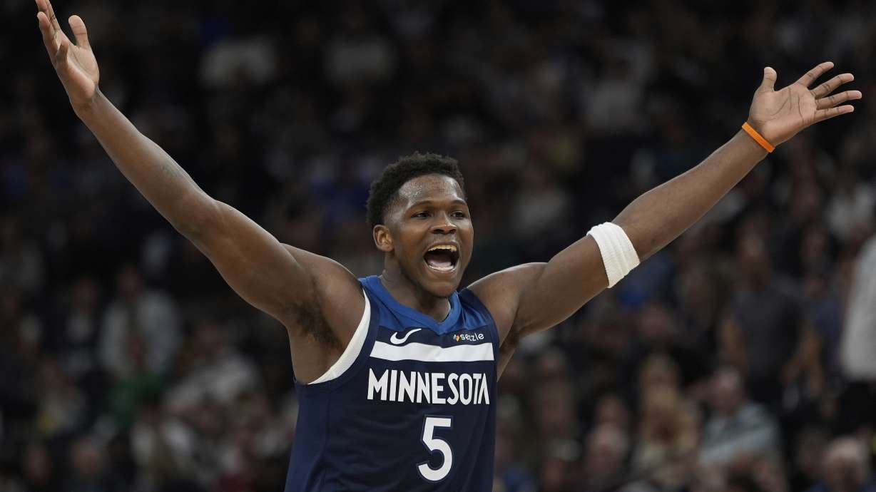 Minnesota Timberwolves guard Anthony Edwards (5) reacts during the second half of an NBA basketball game against the Utah Jazz, Sunday, April 13, 2025, in Minneapolis.