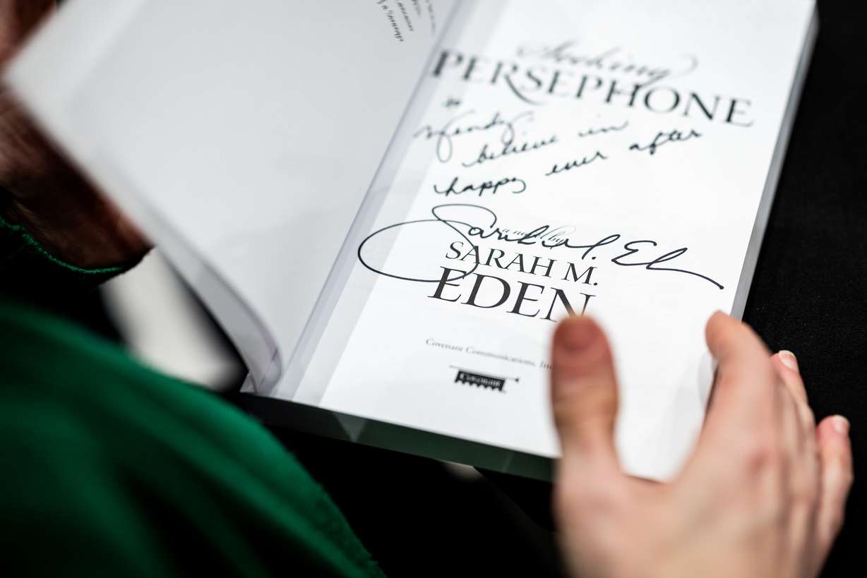 Author Sarah Eden signs books at a Deseret Book event at the City Creek Center in Salt Lake City on April 4.