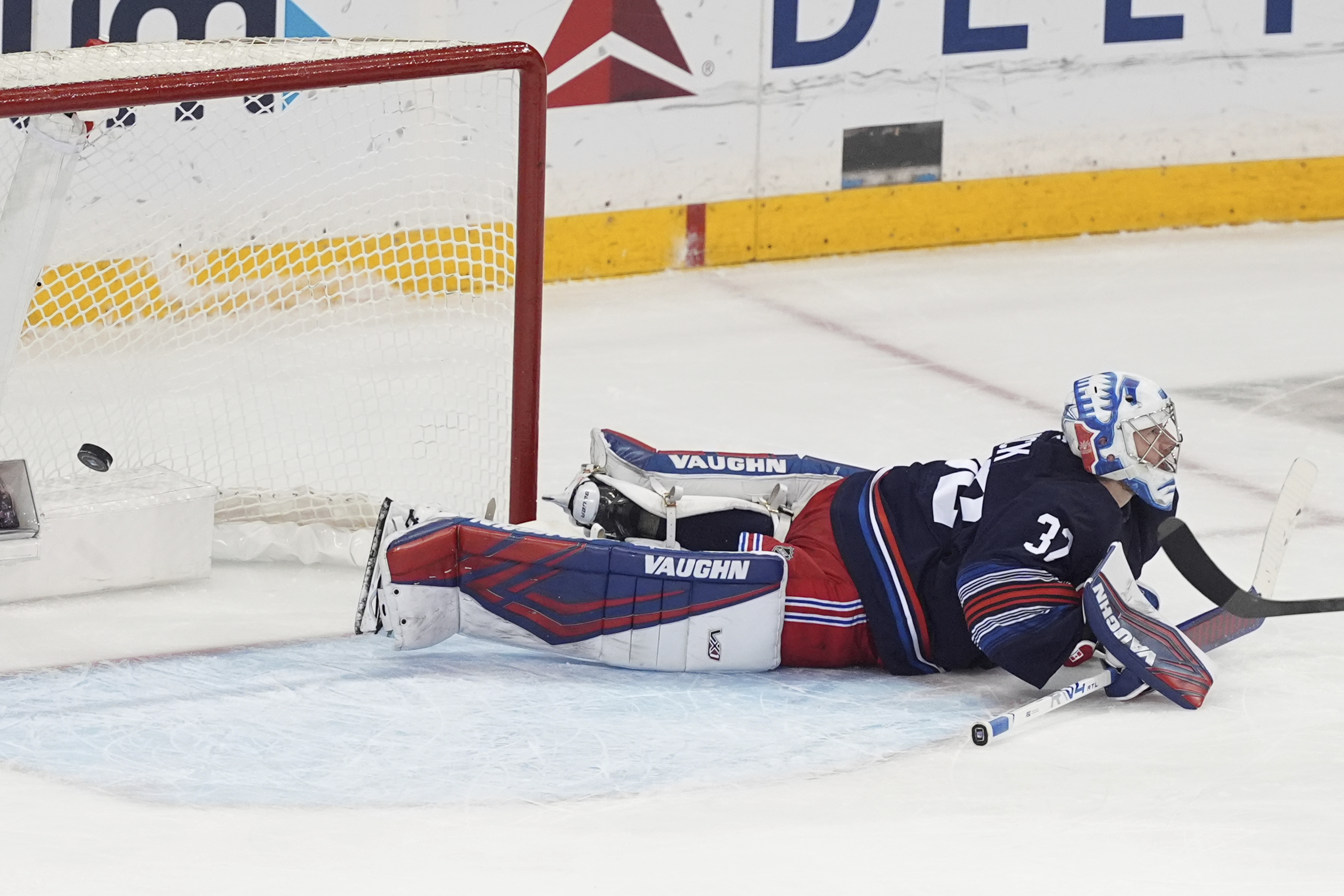 New York Rangers goaltender Jonathan Quick (32) reacts as a puck shot by Philadelphia Flyers' Sean Couturier gets past him for a goal during the third period of an NHL hockey game Wednesday, April 9, 2025, in New York.