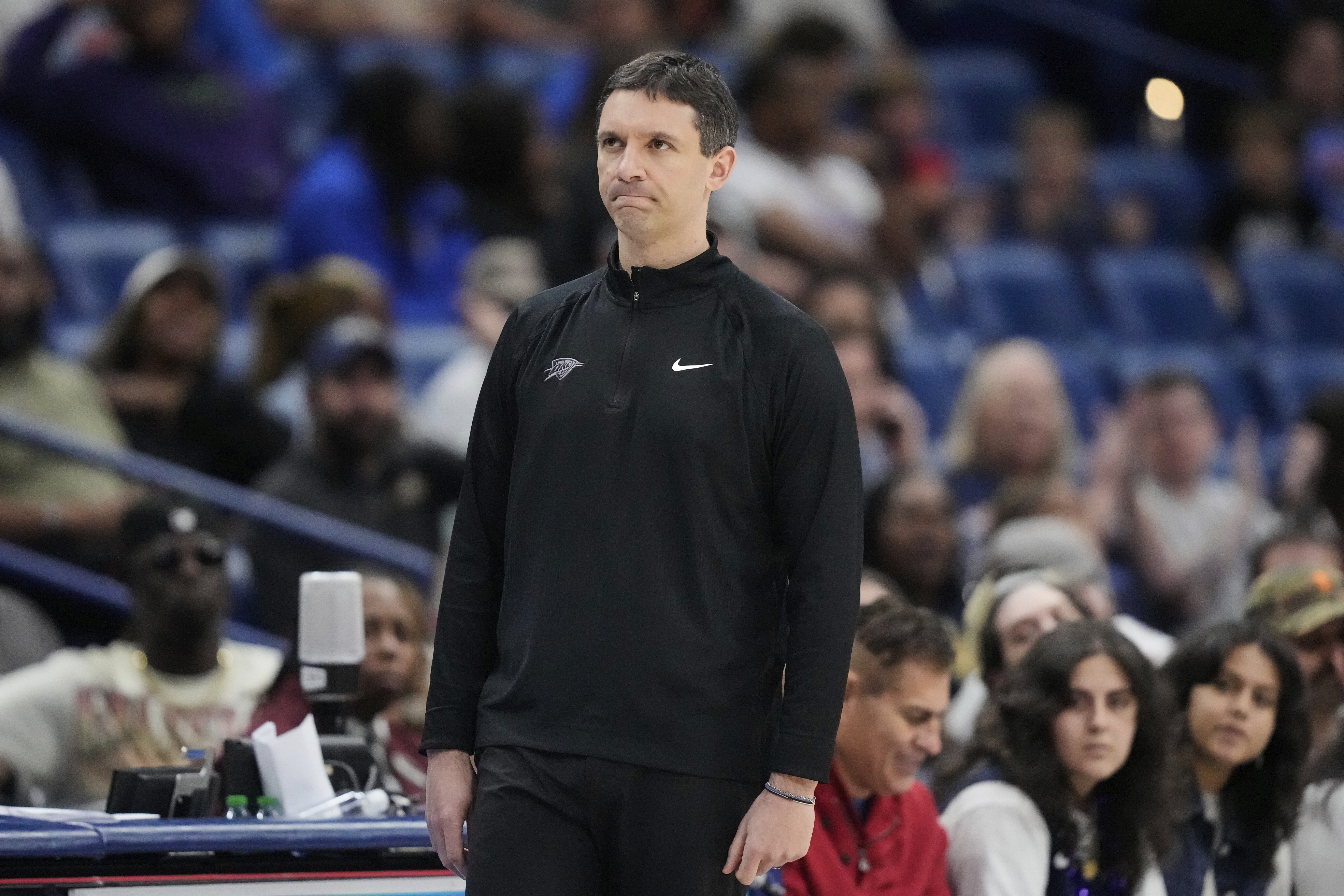 New Orleans Pelicans head coach Mark Daigneault watches from the bench in the second half of an NBA basketball game against the New Orleans Pelicans in New Orleans, Sunday, April 13, 2025.