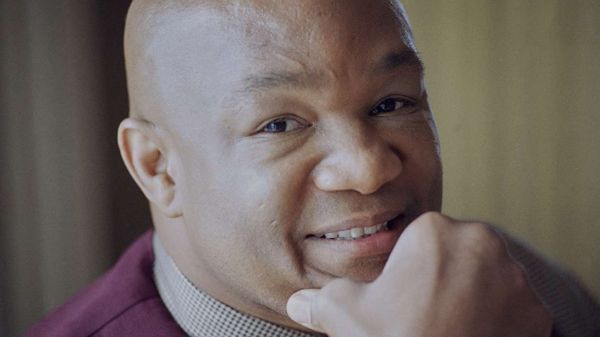 FILE - IBF heavyweight champion George Foreman poses during an interview at a Los Angeles hotel, Friday, May 19, 1995.