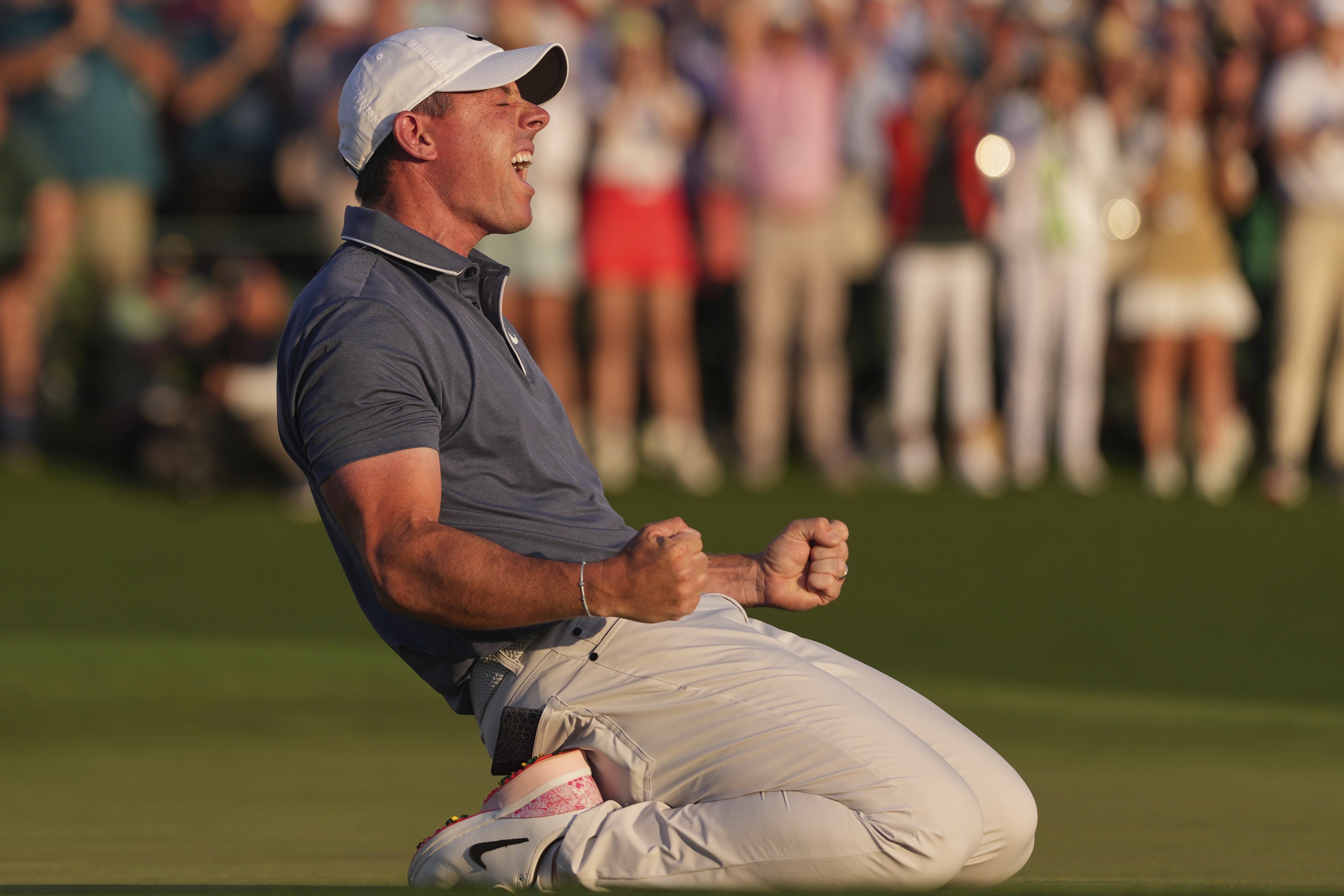 Rory McIlroy, of Northern Ireland, celebrates winning in a playoff against Justin Rose, of England, after the final round the Masters golf tournament, Sunday, April 13, 2025, in Augusta, Ga.