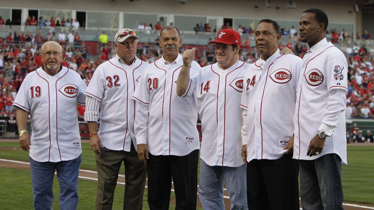 FILE - Former Cincinnati Reds great Pete Rose (14) meets with former teammates, left to right, Tommy Helms, Tom Browning, Cesar Geronimo, Tony Perez, and Eric Davis, during ceremonies celebrating the 25th anniversary of Rose breaking Ty Cobb's hit record prior to a baseball game between the Reds and Pittsburgh Pirates, Saturday, Sept. 11, 2010, in Cincinnati.