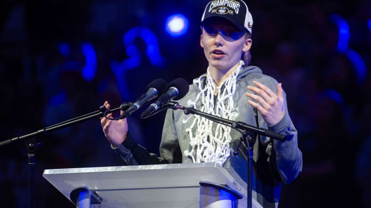 UConn's Paige Bueckers speaks to fans during an NCAA college basketball "Championship Welcome Home Rally" for the team Monday, April 7, 2025, Storrs, Conn.