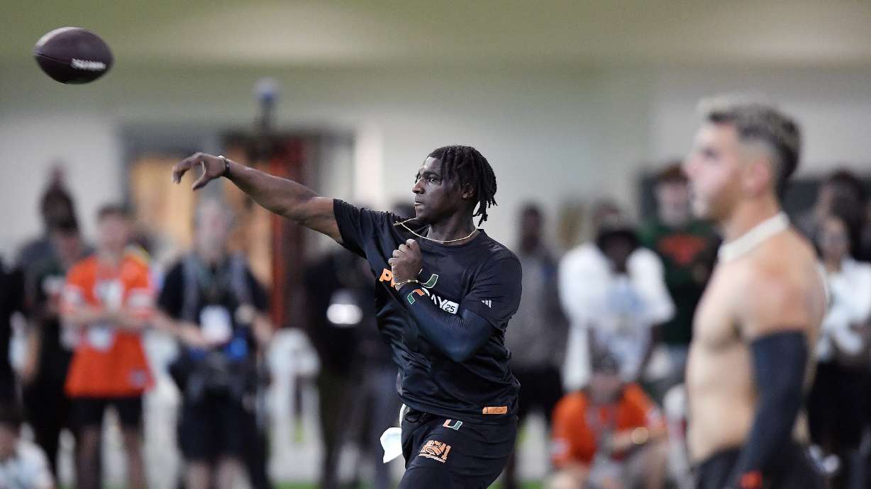 Miami quarterback Cam Ward, center, throws the ball during a drill at the school's NFL football pro day Monday, March 24, 2025, in Coral Gables, Fla.