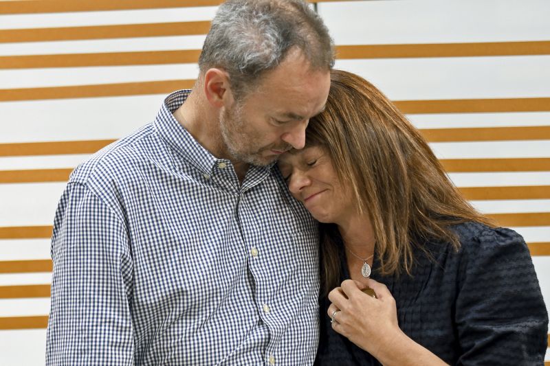 Simon and Sally Glass comfort each other during an emotional news conference about the death of their son, Christian Glass, in Denver, Sept. 13, 2022.