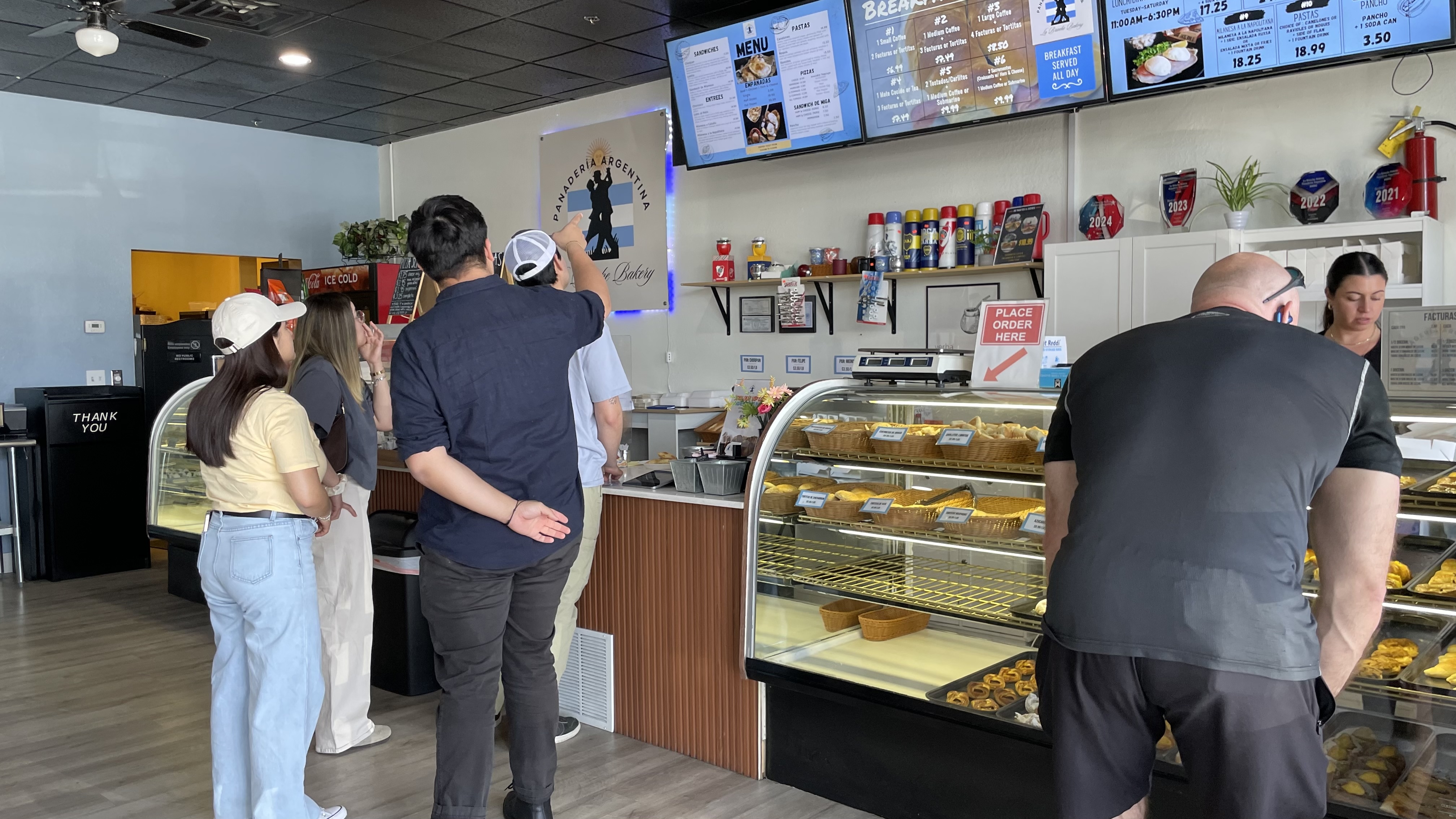 Customers ordering at La Brioche Bakery on Thursday in Orem.