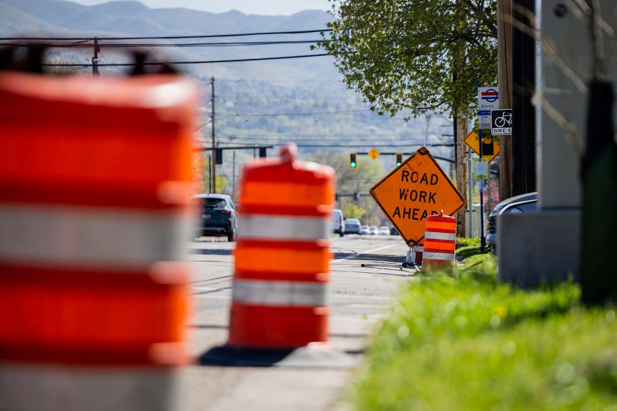 Cones and construction signage along 600 North near Redwood Road in the Rose Park neighborhood in Salt Lake City on Monday.
