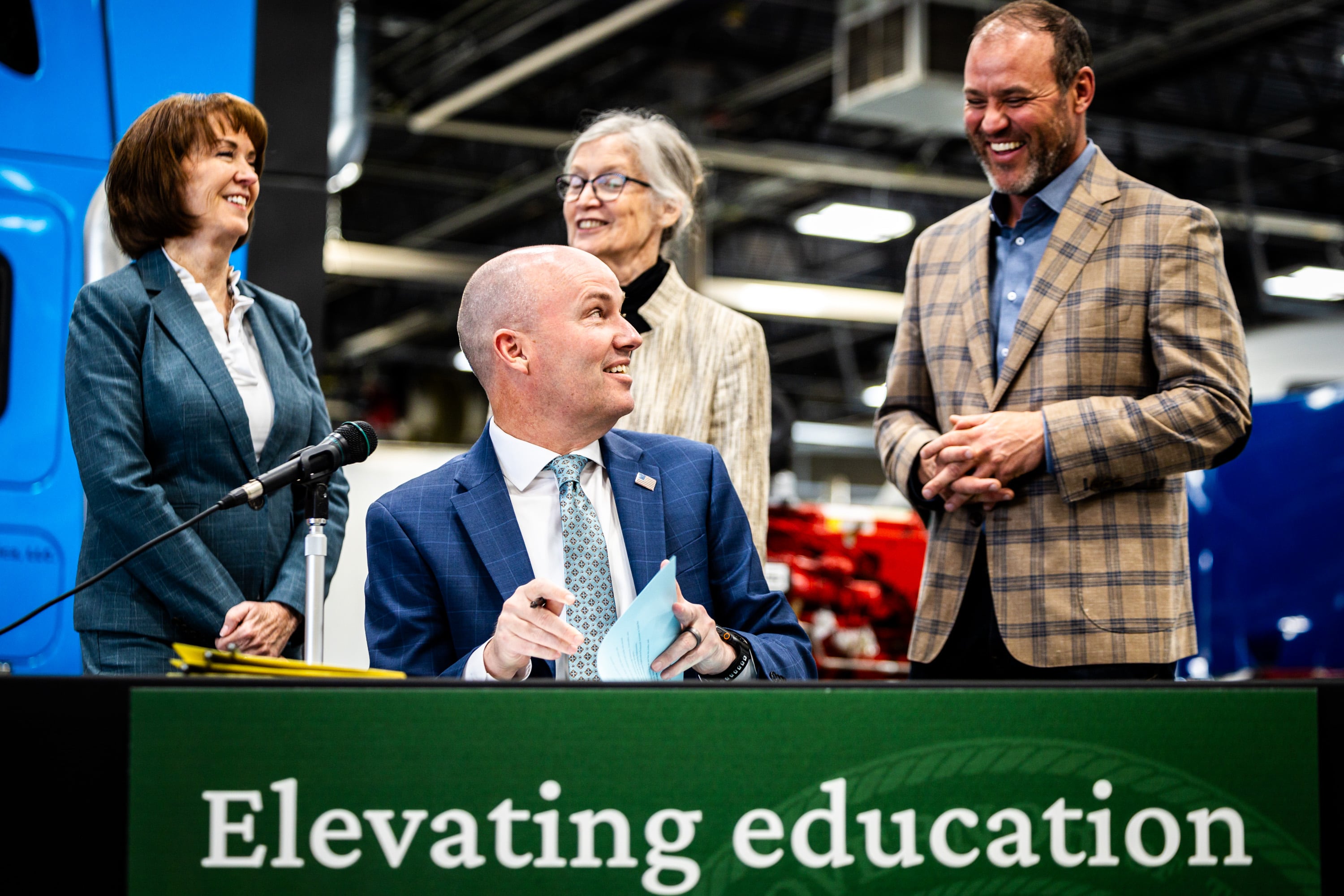 Gov. Spencer Cox ceremonially signs HB447, sponsored by Speaker of the House Mike Schultz, R-Hooper, right, at Davis Technical College in Kaysville on Monday.