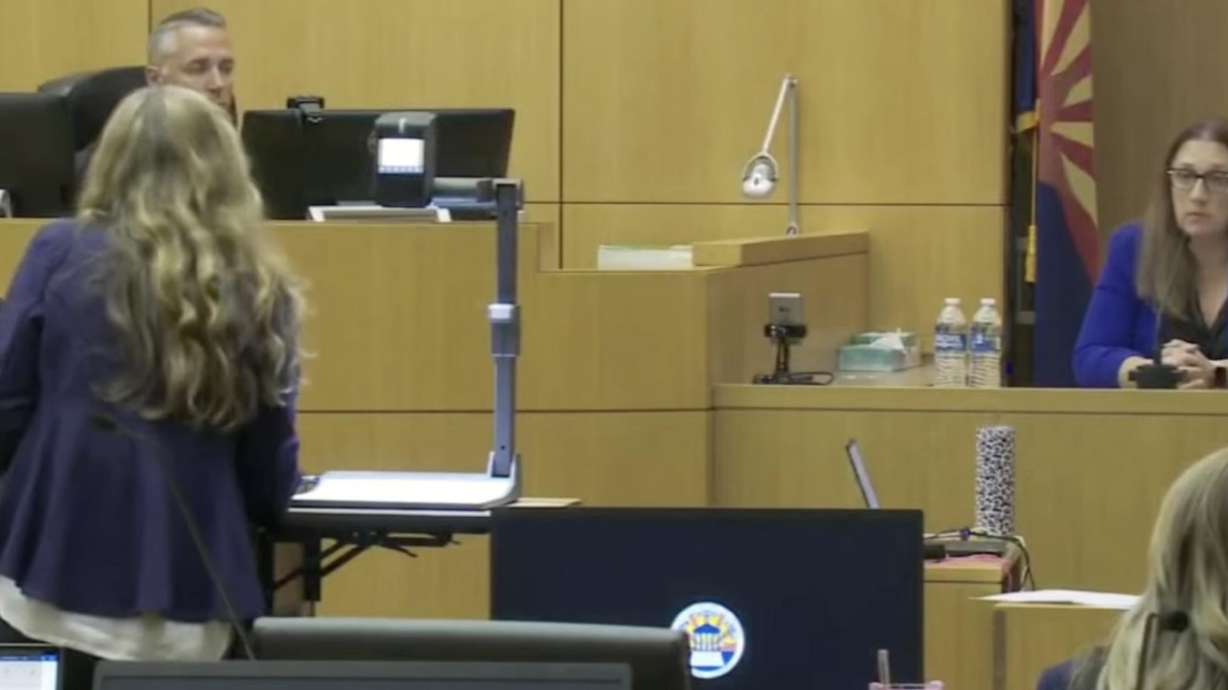 Cassandra Ynclan, with the Chandler, Arizona, police department, is questioned Monday by Lori Daybell about interviews she had with Daybell hours after Daybell's husband's death.