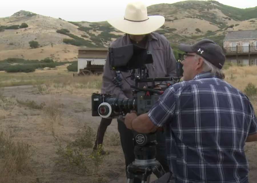 Writer and director T.C. Christensen, right, is seen in this undated photo on the set of “Raising the Bar: The Alma Richards Story.”