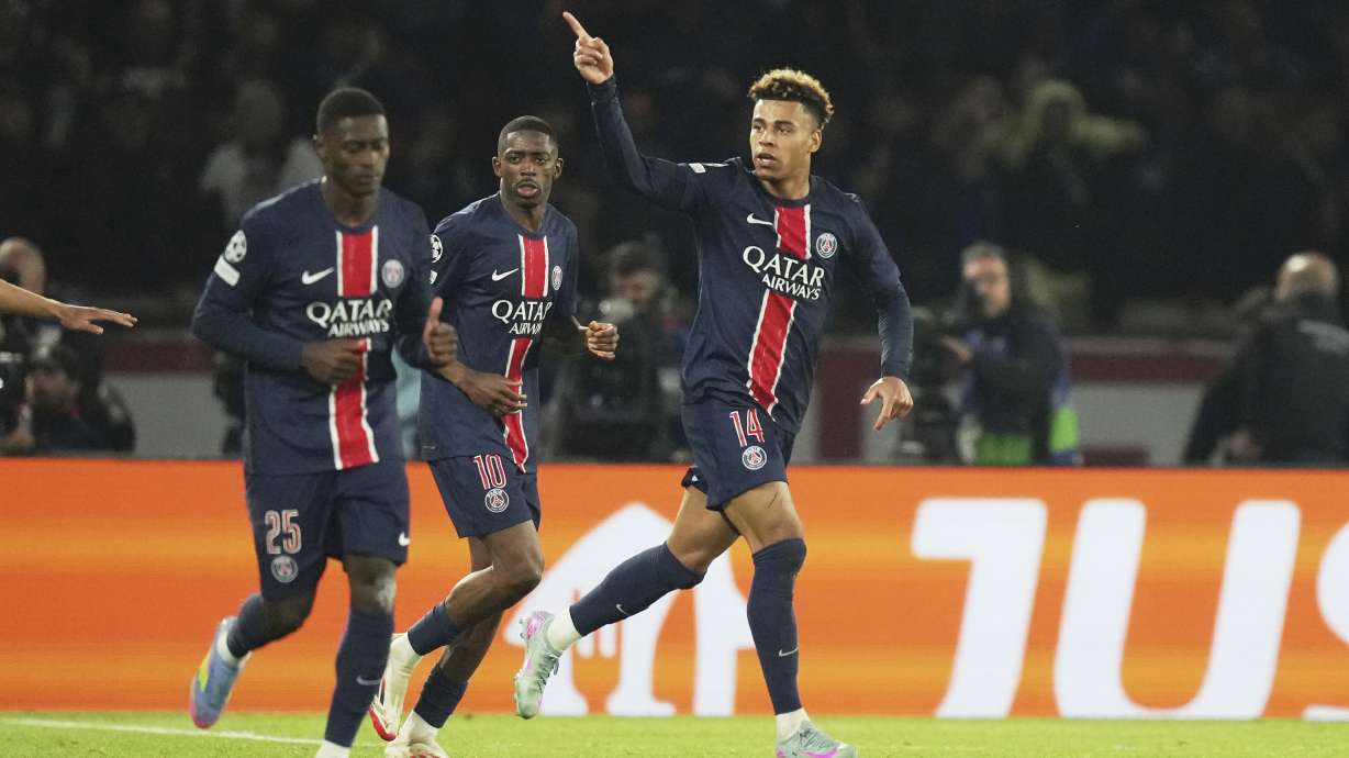 PSG's Desire Doue celebrates after scoring his side's first goal during the Champions League quarterfinal first leg soccer match between Paris Saint-Germain and Aston Villa at Parc des Princes stadium in Paris, Wednesday, April 9, 2025.