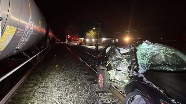 A car is pictured after being hit by a train at 400 North and 400 West in Springville, Saturday.