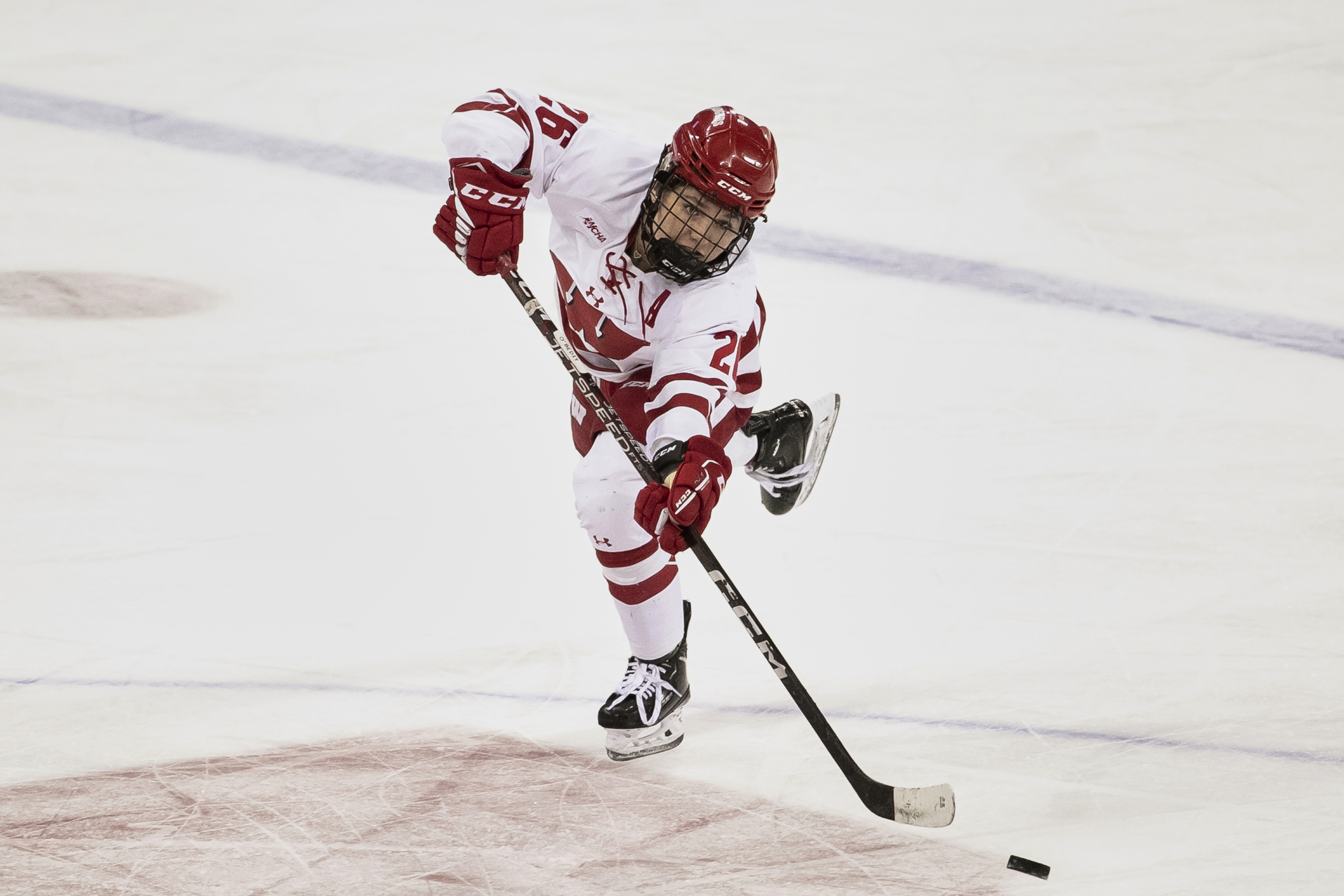 FILE - Wisconsin forward Casey O'Brien (26) passes the puck in the third period against St. Cloud State at the Kohl Center in Madison, Wis., Friday, Feb. 3, 2023.