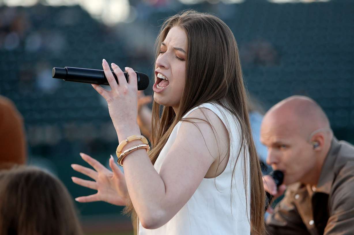 Abi Burton performs with J209 at the Why I Believe Interfaith Easter Celebration at the Ballpark at America First Square in South Jordan on Monday.