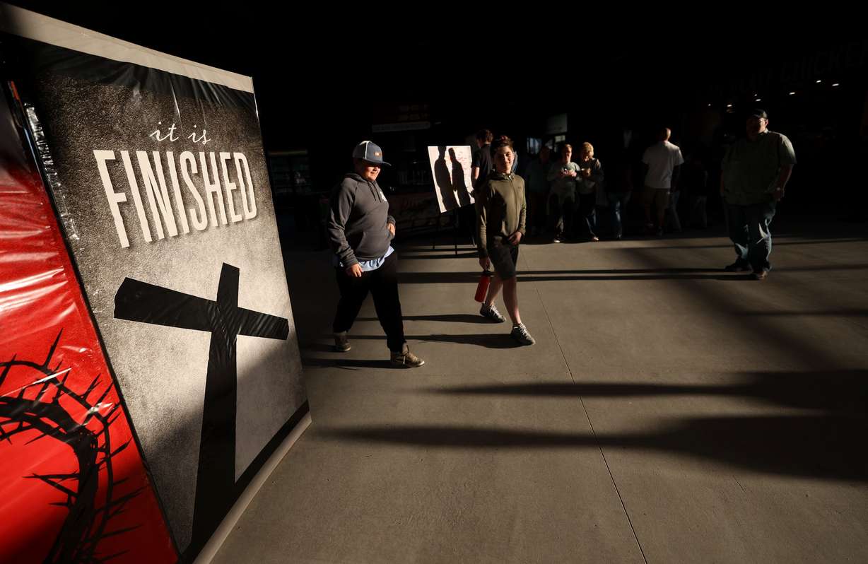 People walk through the Ballpark at America First Square for the Why I Believe Interfaith Easter Celebration in South Jordan on Monday.