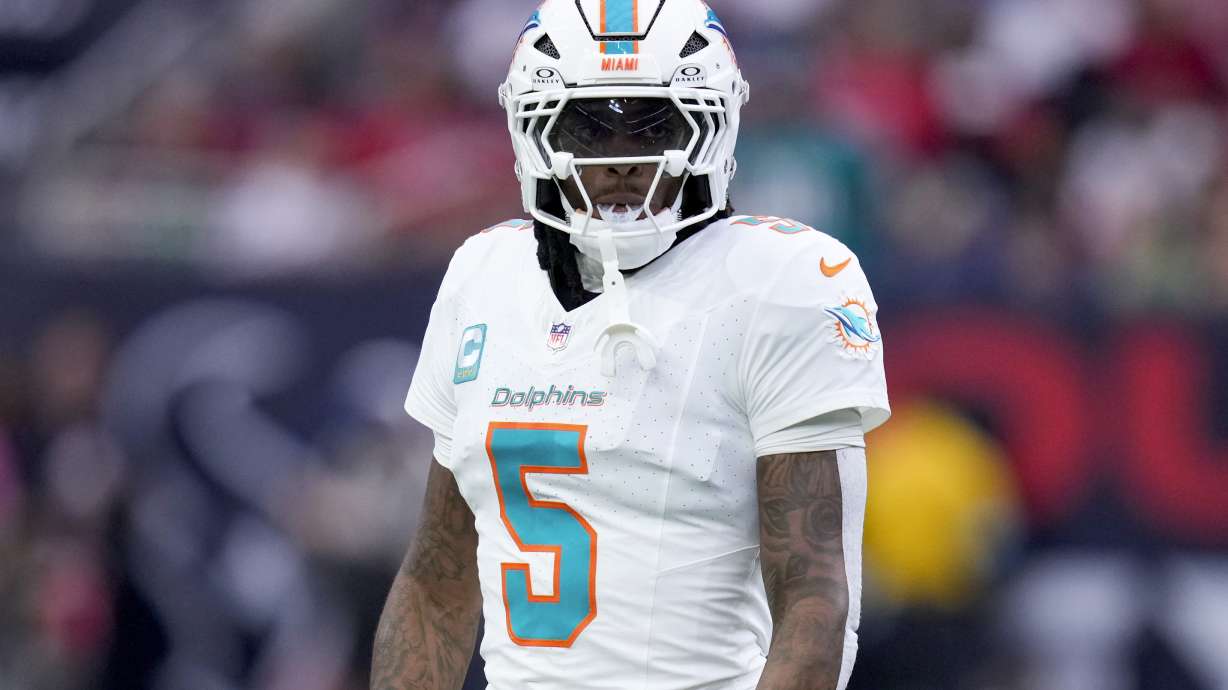 FILE - Miami Dolphins cornerback Jalen Ramsey walks on the field during the first half of an NFL football game against the Houston Texans , Dec. 15, 2024, in Houston.