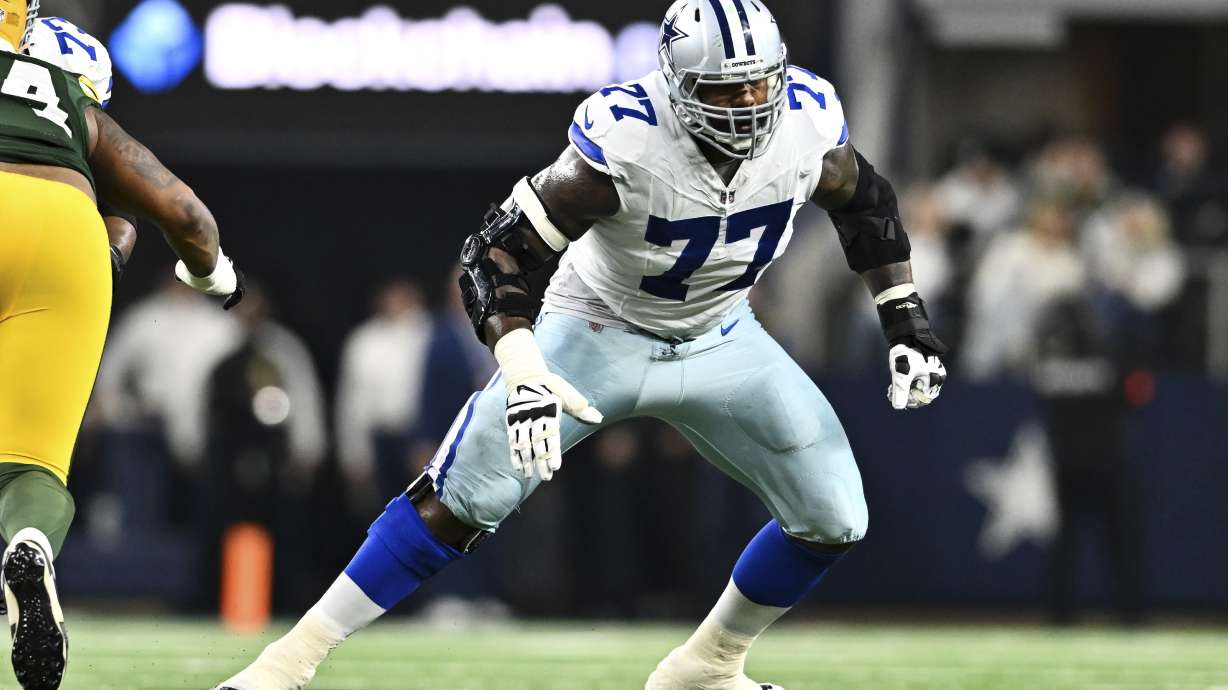 FILE - Dallas Cowboys offensive tackle Tyron Smith (77) in action against the Green Bay Packers during an NFL wild-card playoff football game Sunday, Jan. 14, 2024 in Arlington, Texas.