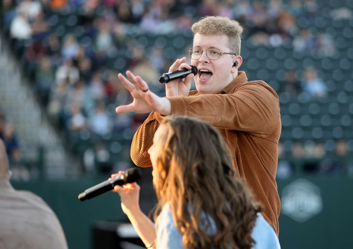 Jimmy Mohlman performs with J209 at the Why I Believe Interfaith Easter Celebration at the Ballpark at America First Square in South Jordan on Monday.