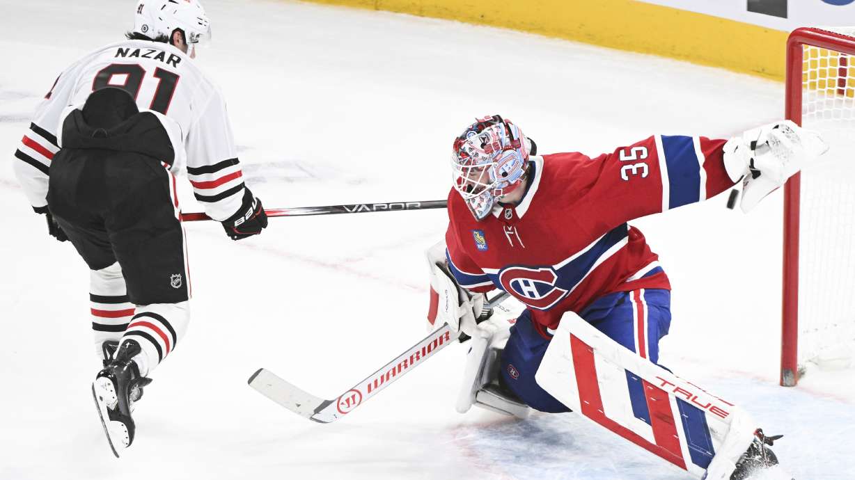 Chicago Blackhawks' Frank Nazar (91) scores against Montreal Canadiens goaltender Sam Montembeault, right, during shootout NHL hockey game action in Montreal, Monday, April 14, 2025.