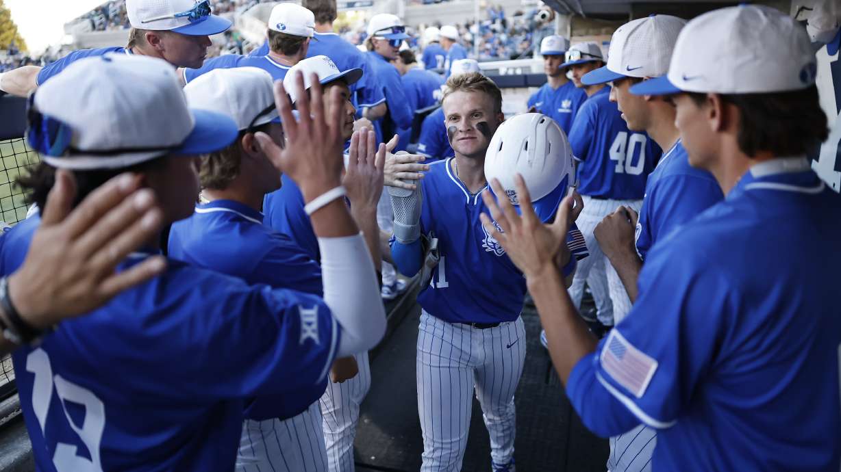 BYU baseball celebrates a run during a 9-3 win over crosstown rival Utah Valley, Tuesday, April 15, 2025 at Larry H. Miller Park in Provo, Utah.