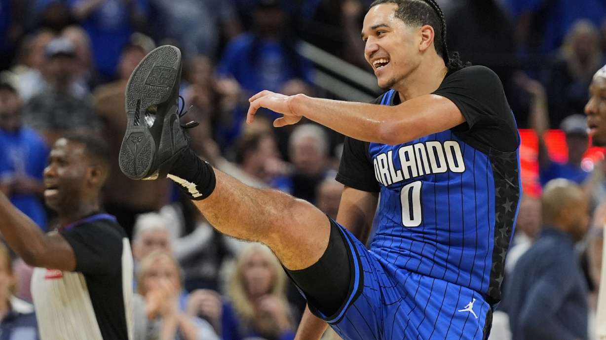 Orlando Magic guard Anthony Black (0) makes a kicking gesture after Atlanta Hawks player Trae Young was ejected from the game during the second half of an NBA play-in tournament basketball game, Tuesday, April 15, 2025, in Orlando, Fla.