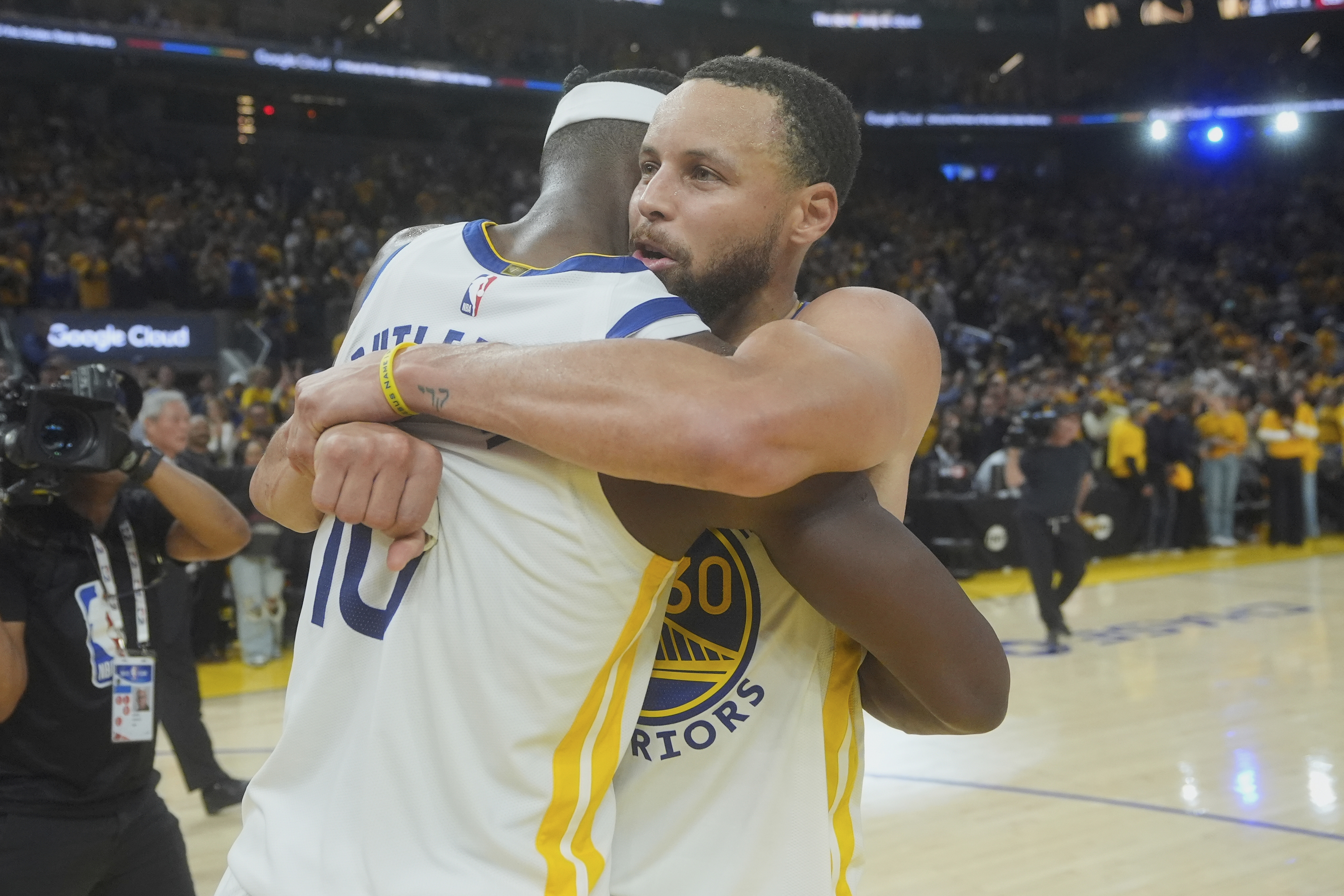 Butler, Curry lead Warriors past Grizzlies 121-116 to secure seventh seed in West playoffs